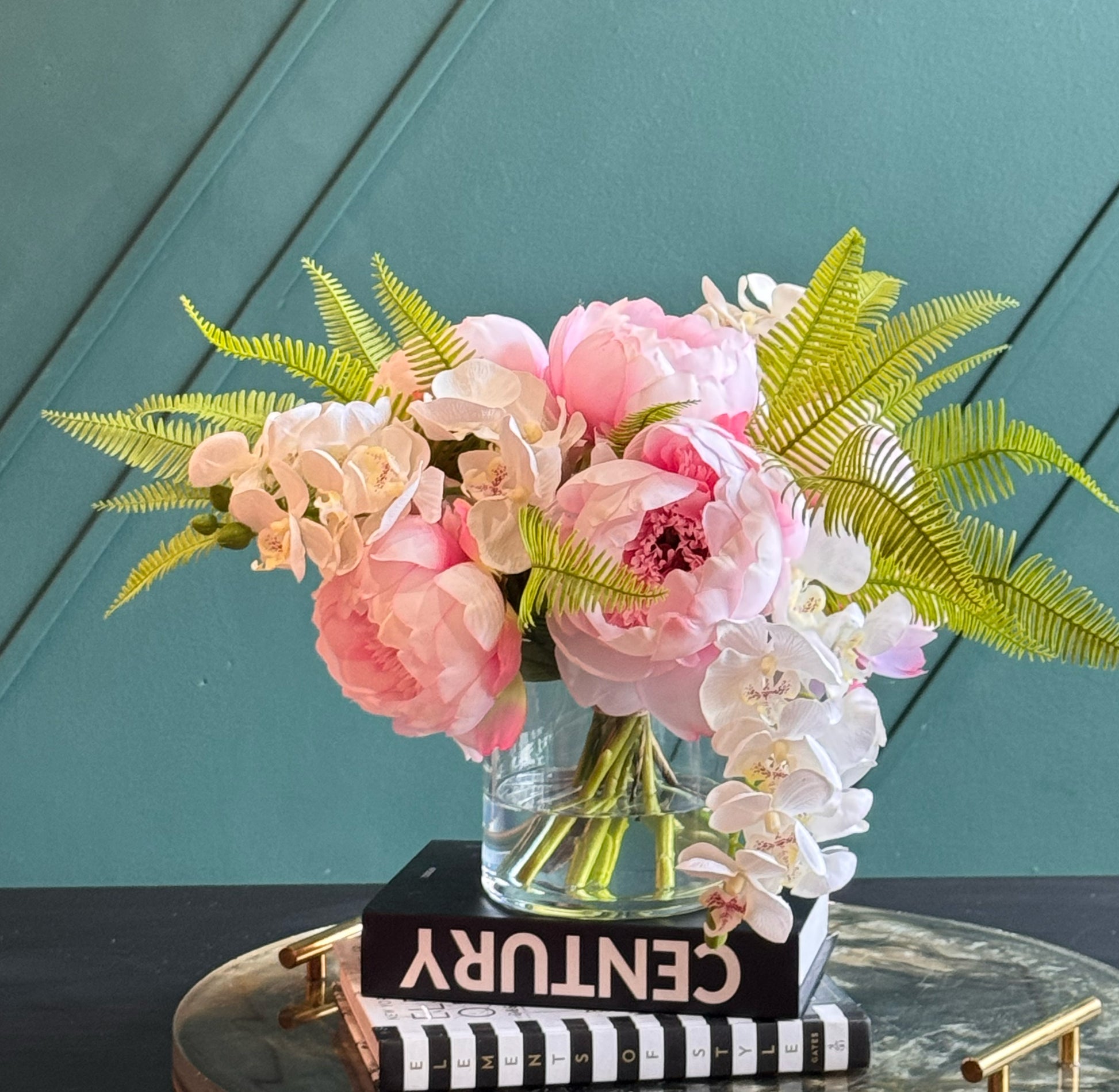 Elegant faux peony and orchid floral arrangement in a glass vase for luxury home and office décor.