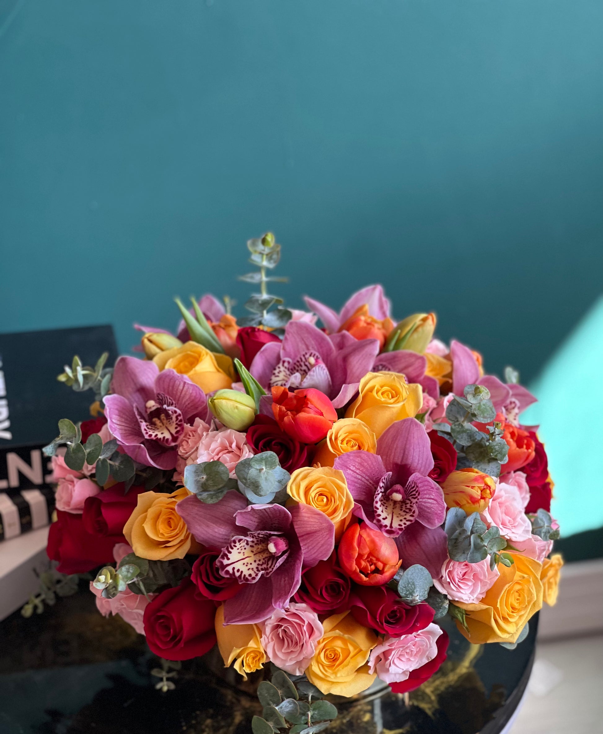 Elegant floral centerpiece in a gold vase