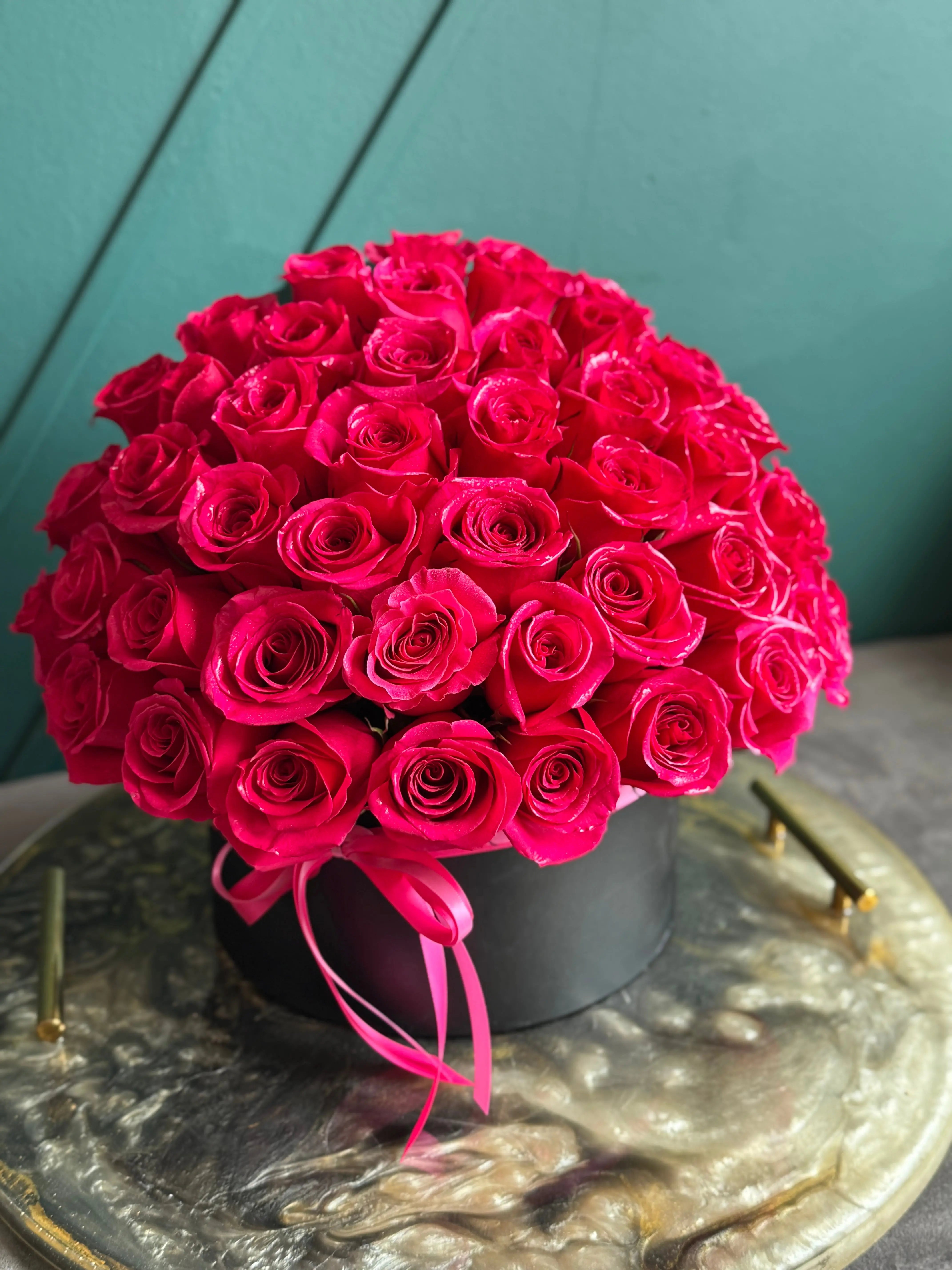 Elegant flower box filled with 50 vibrant hot pink roses