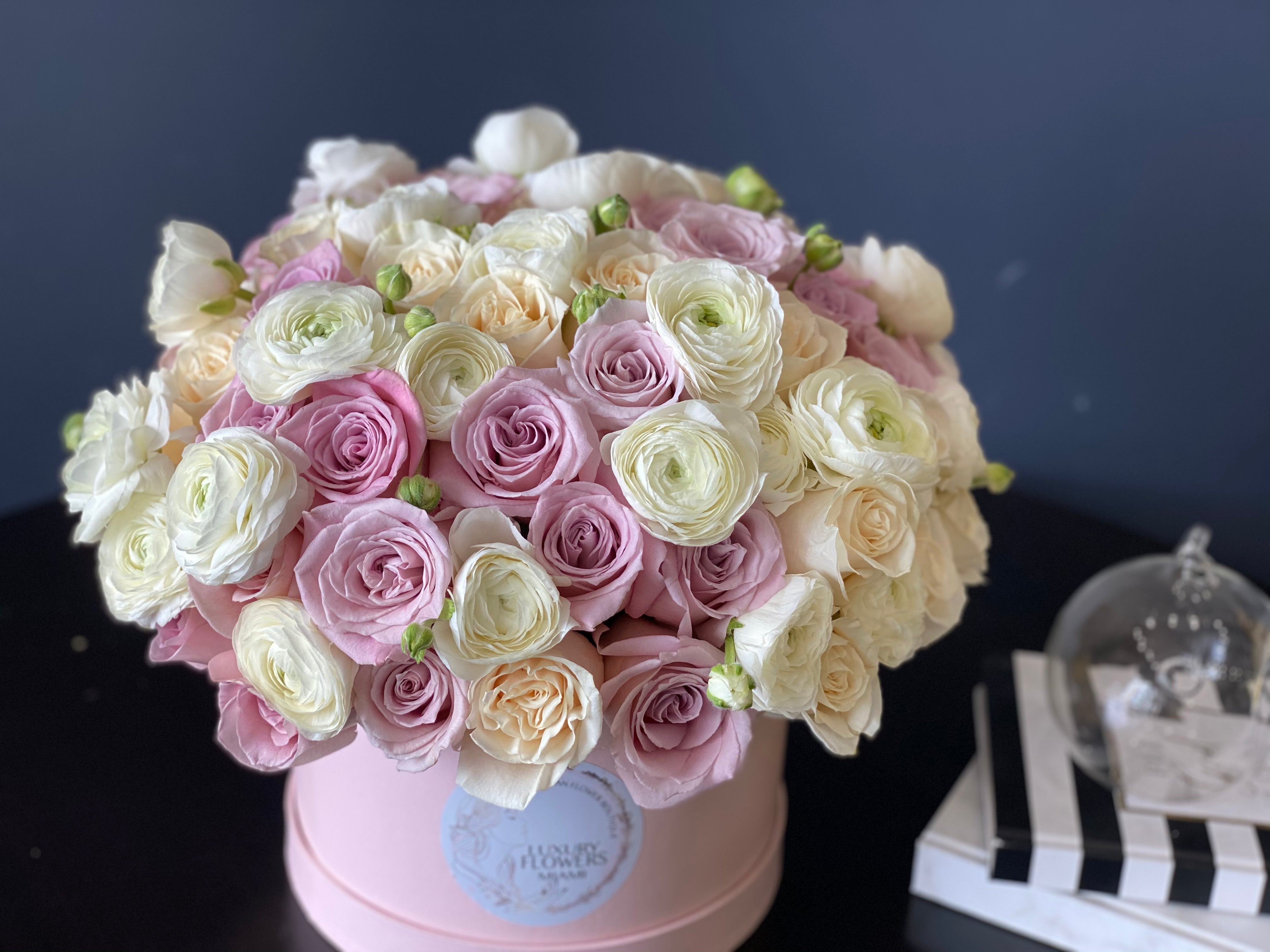 Elegant pastel flower box with roses and ranunculus