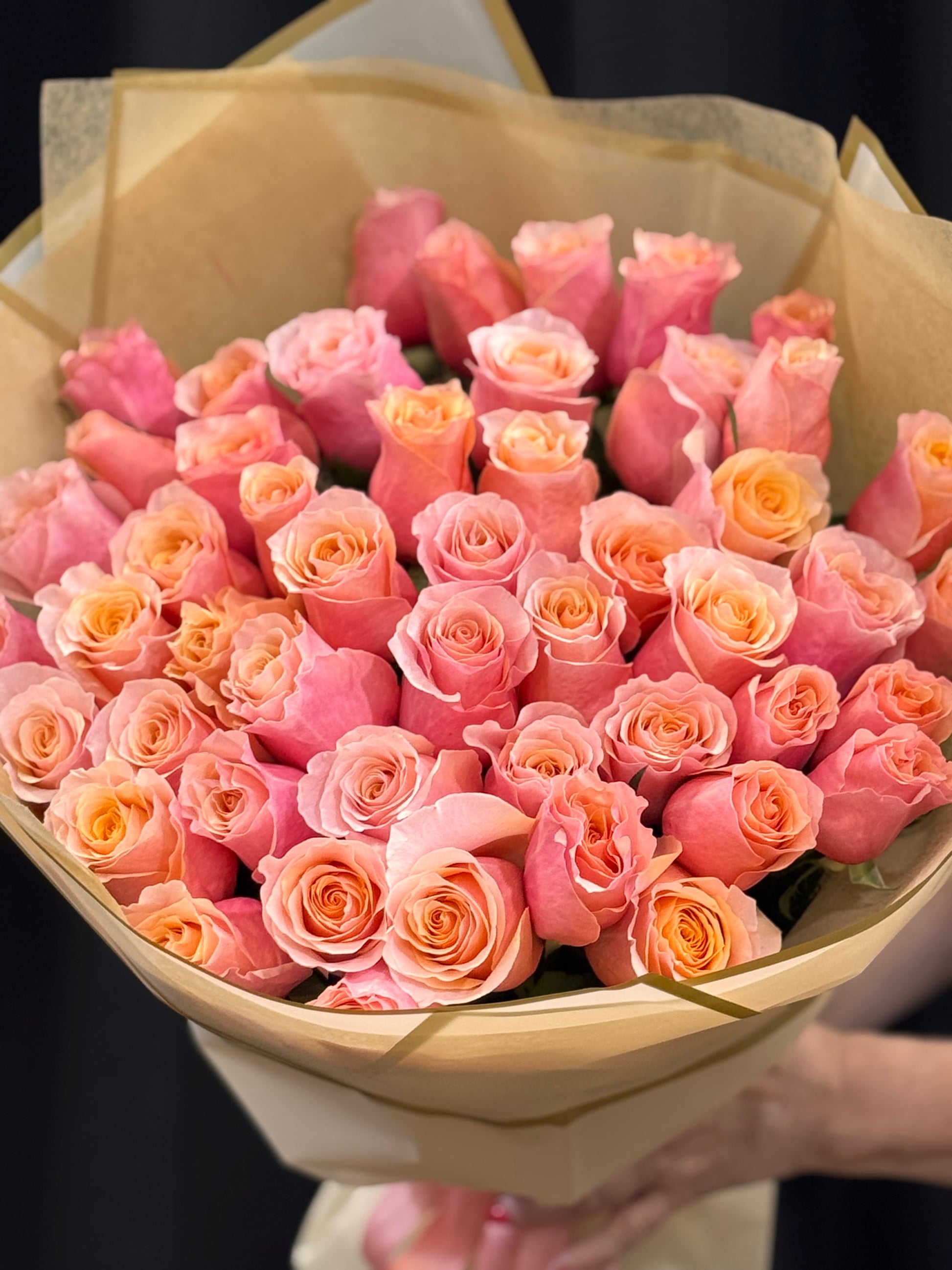 Elegant pink-peach rose bouquet handcrafted by Luxury Flowers Miami