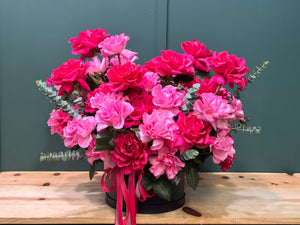 Elegant pink and fuchsia French roses in a modern black floral box