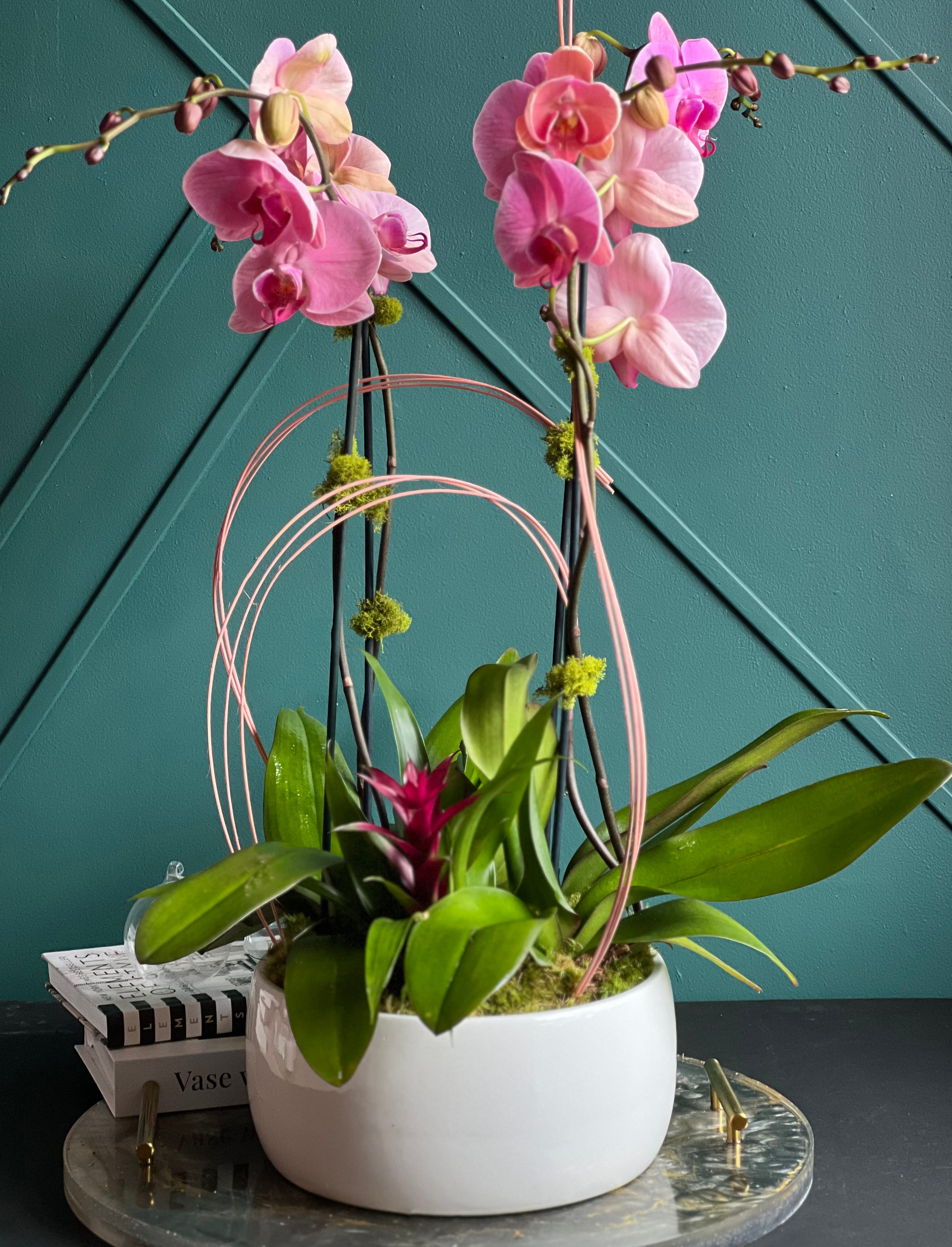 Elegant pink orchid and bromeliad arrangement for luxury interiors