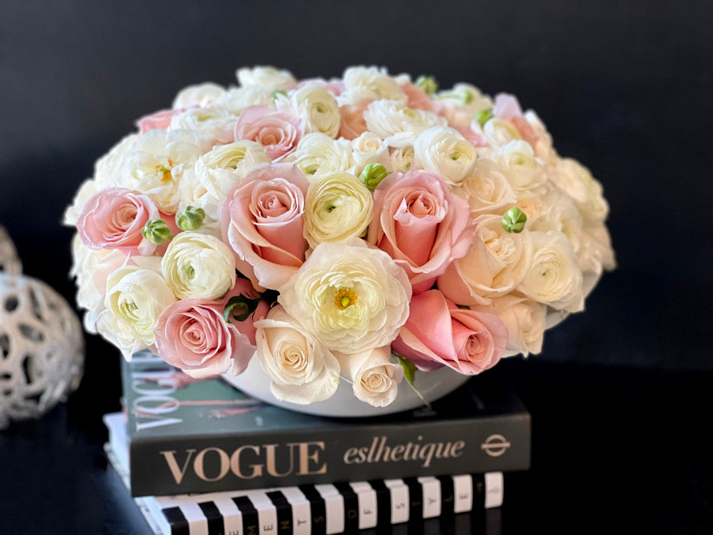 Elegant pink white roses and ranunculus flower arrangement