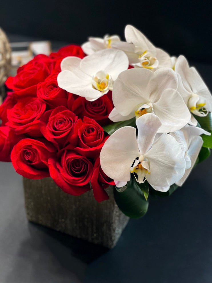 Elegant roses and orchids arrangement in a vase