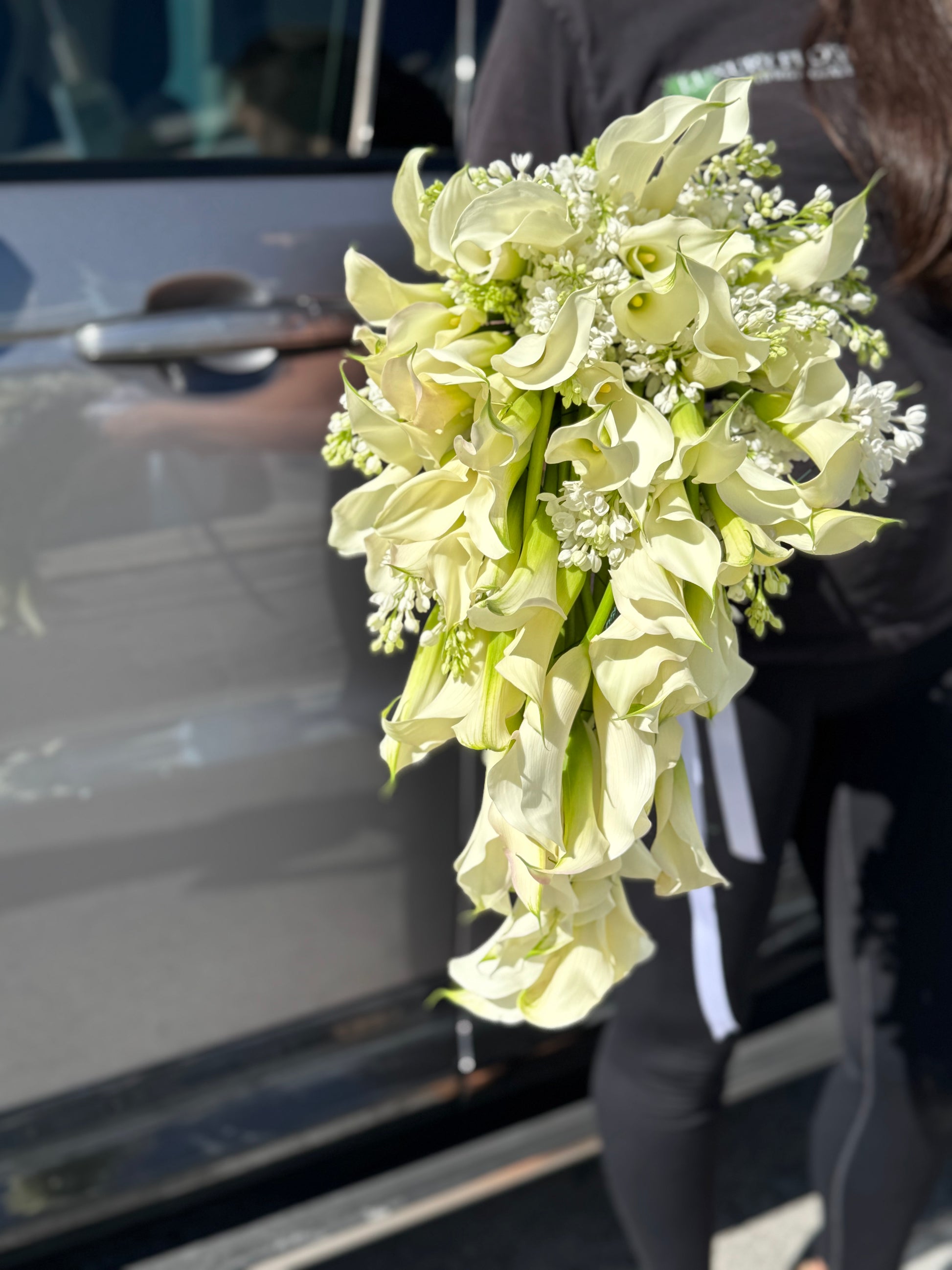 Elegant waterfall bridal bouquet with calla lilies