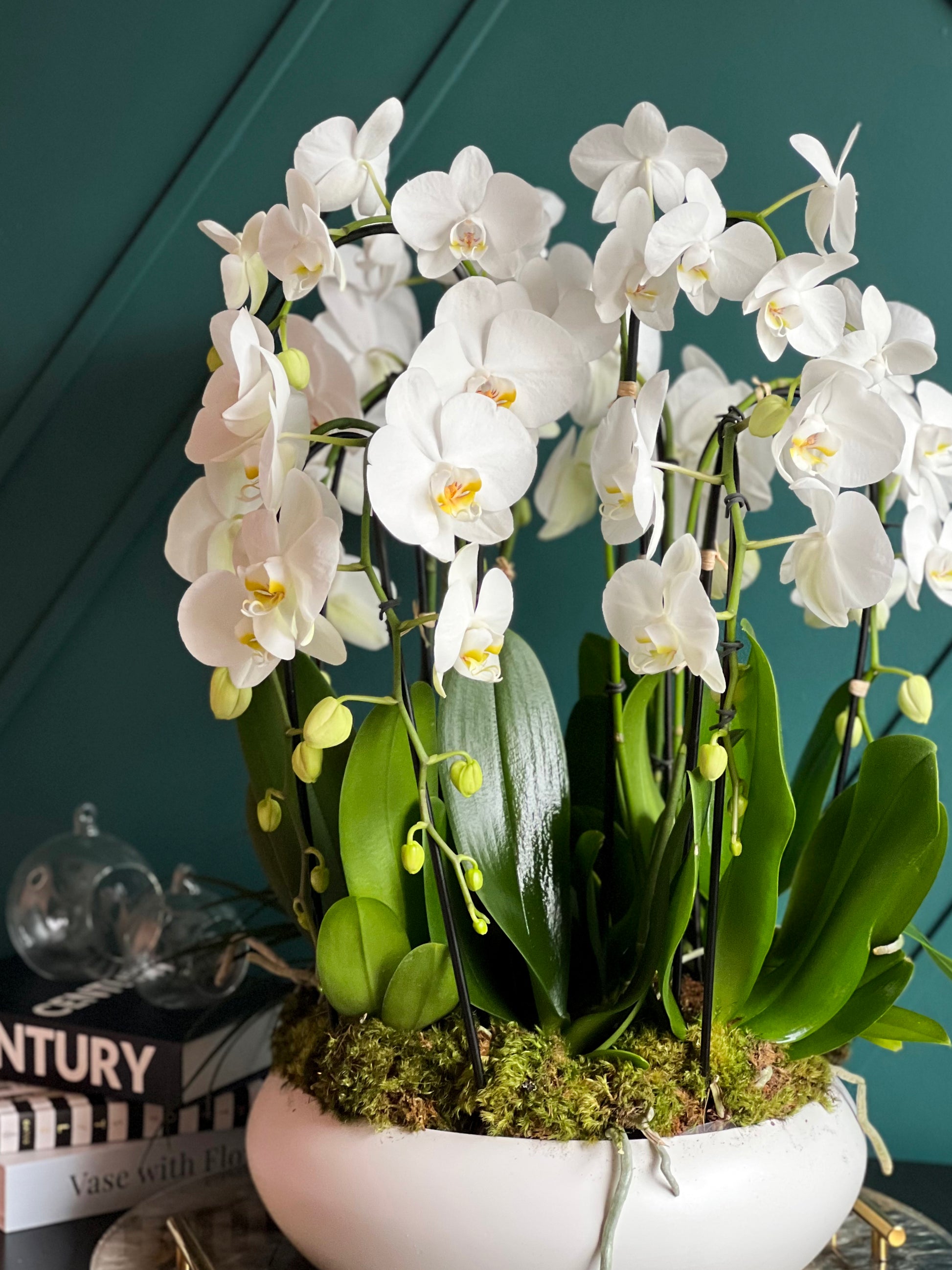 Elegant waterfall orchid centerpiece by Luxury Flowers Miami