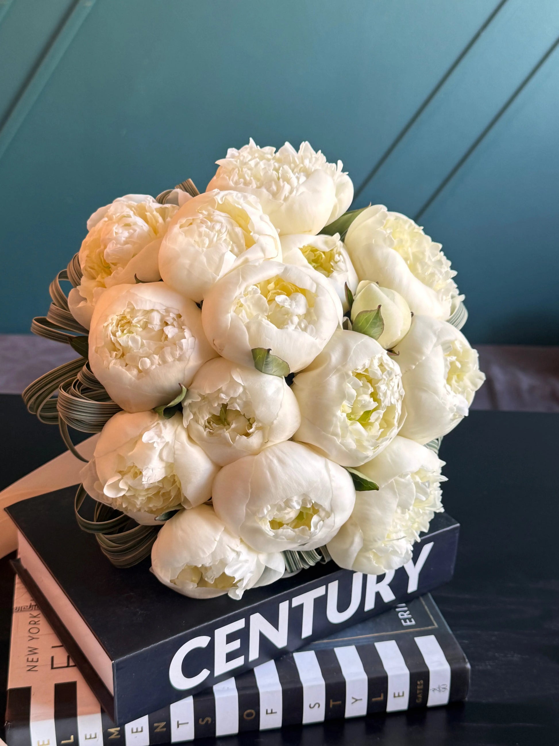 Elegant white peonies wedding bouquet with ribbon
