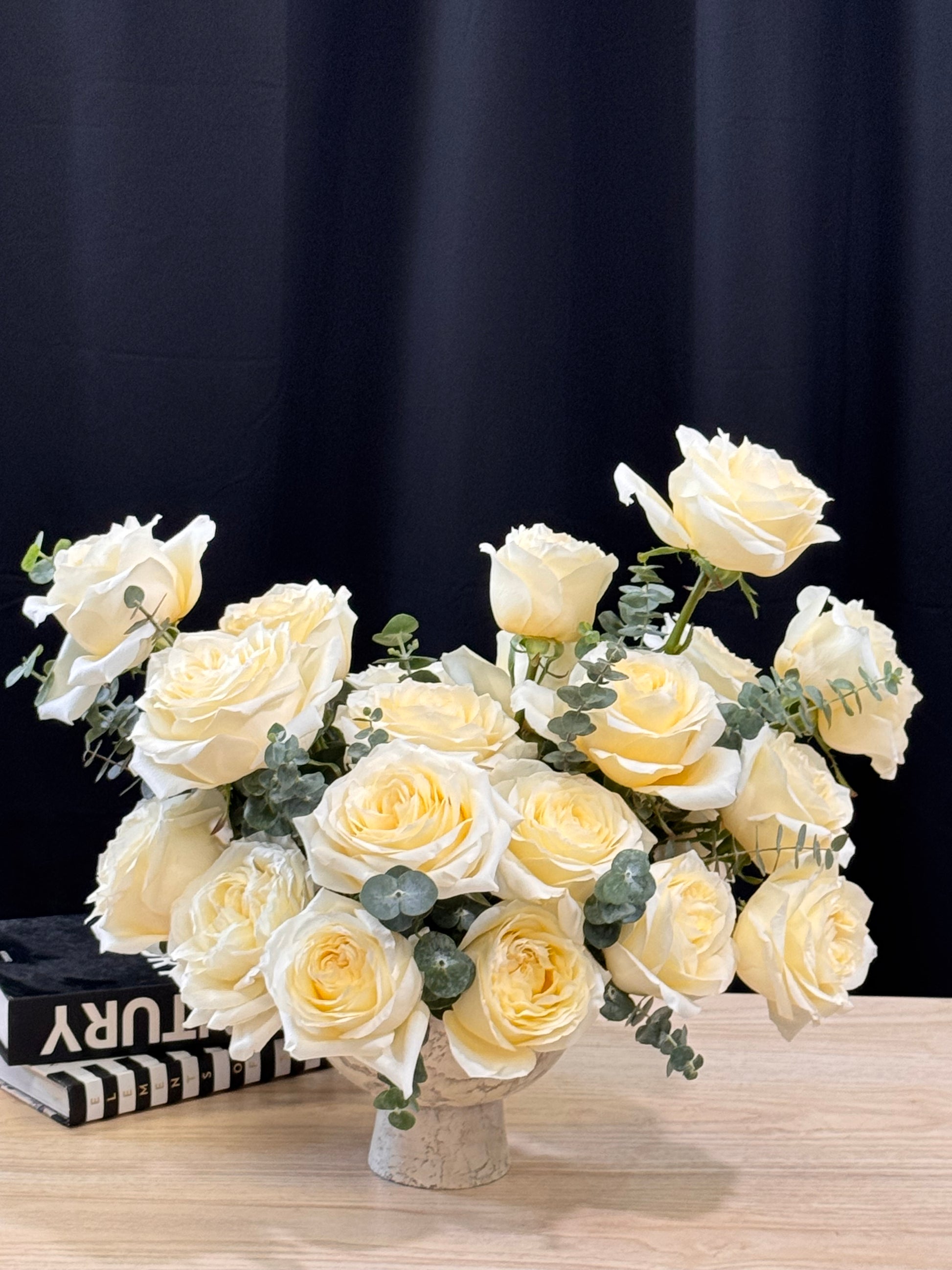 Elegant white rose centerpiece with greenery Miami