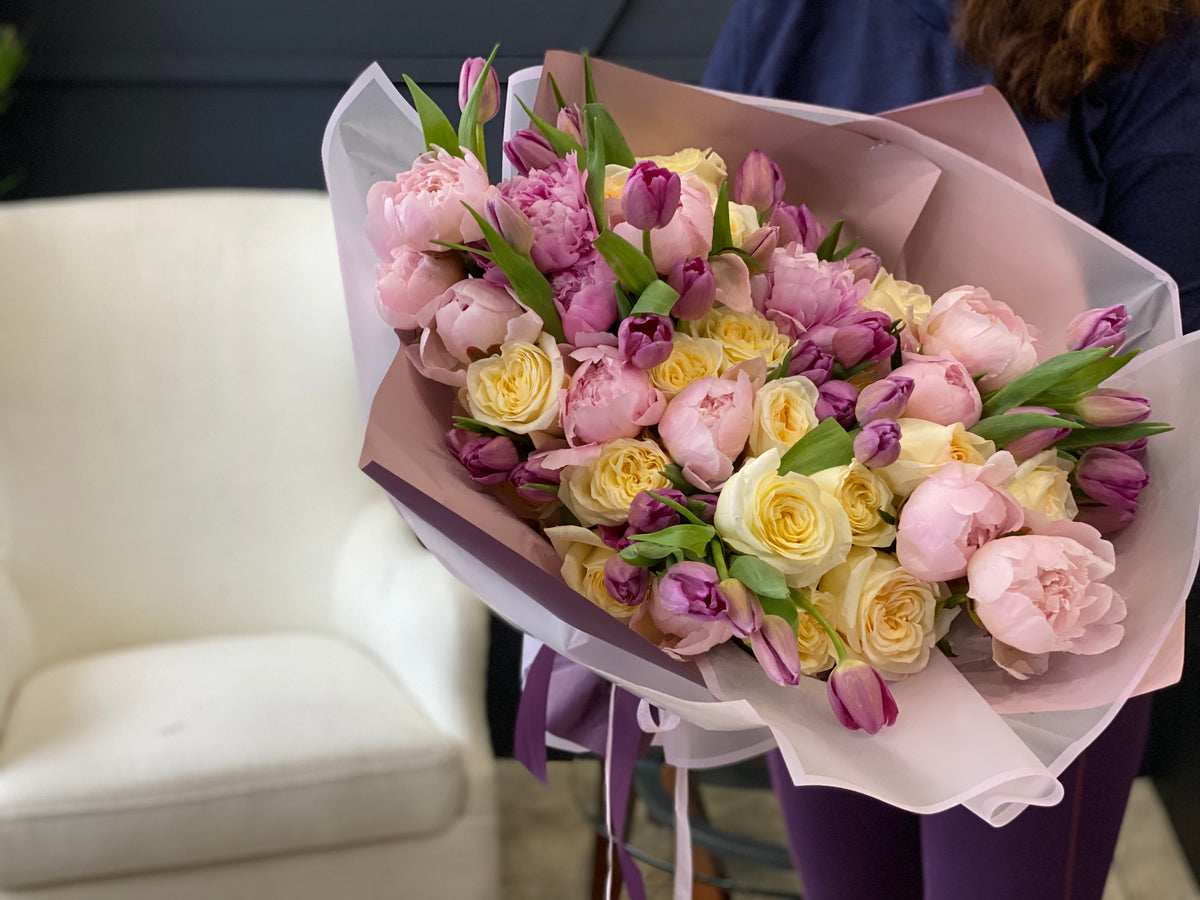 European style bouquet with roses tulips and seasonal flowers