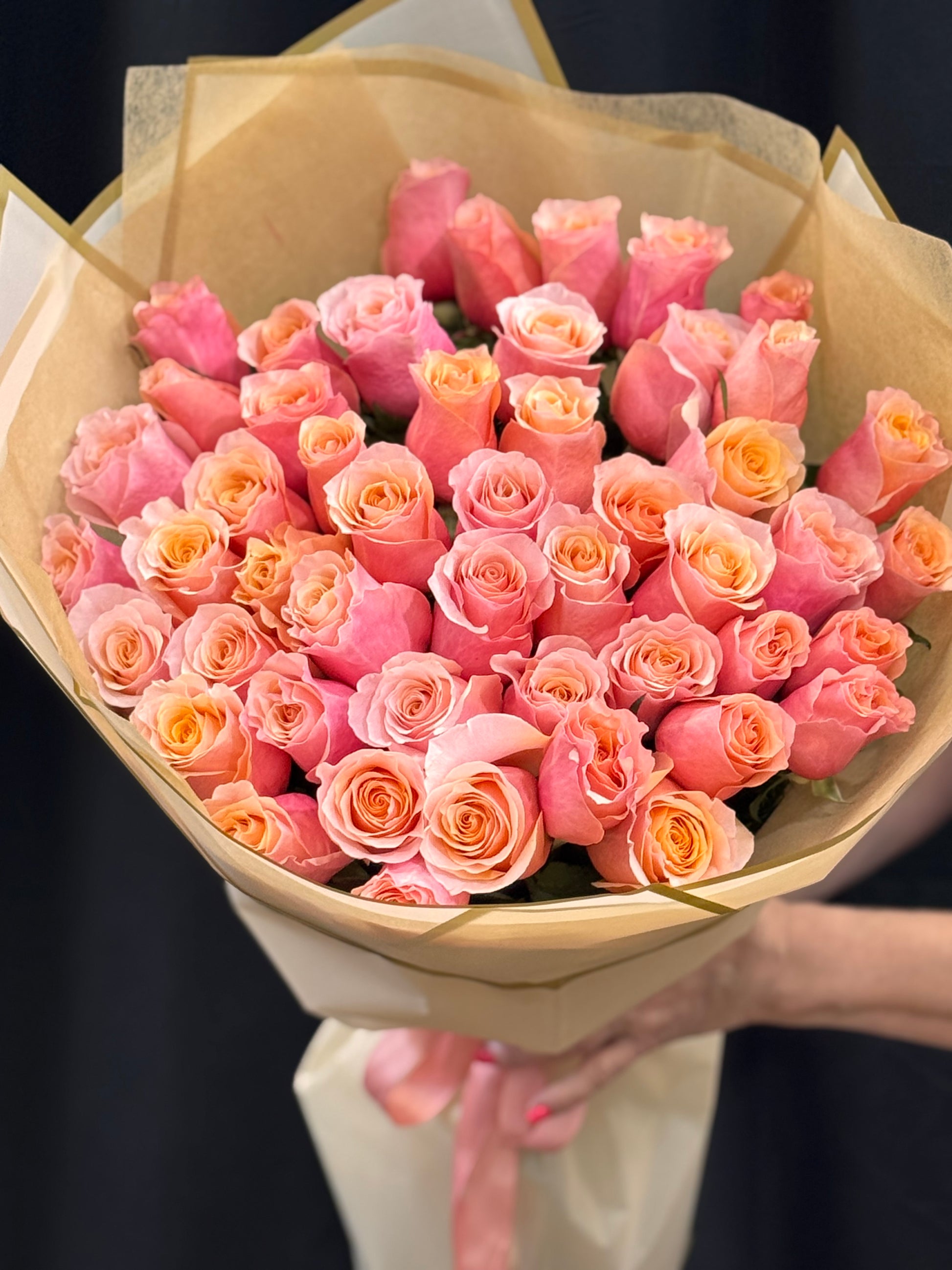 Flamingo-inspired bouquet of 50 fresh pink and peach roses