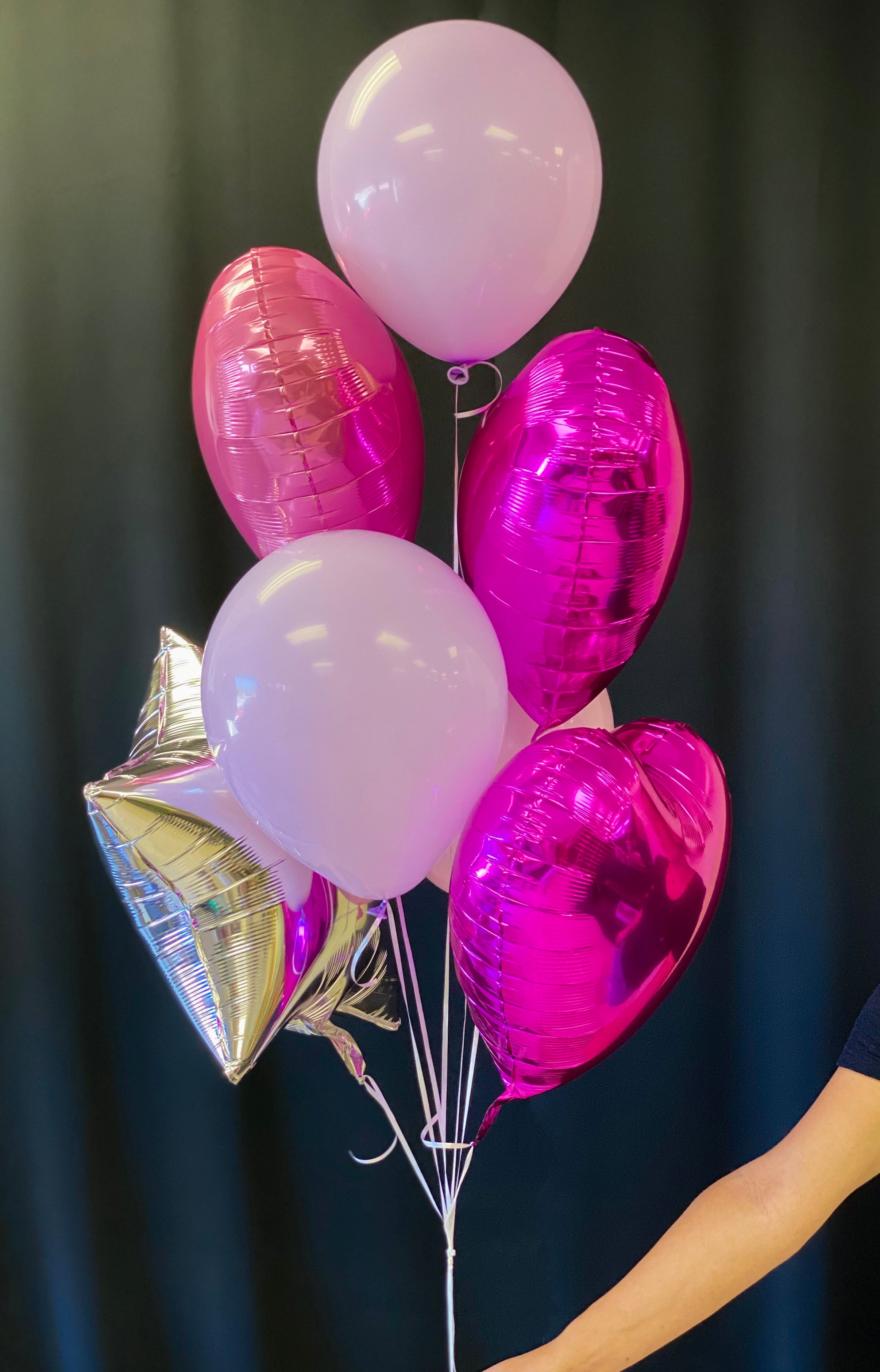 Foil and latex balloon bouquet with pink hearts and silver star