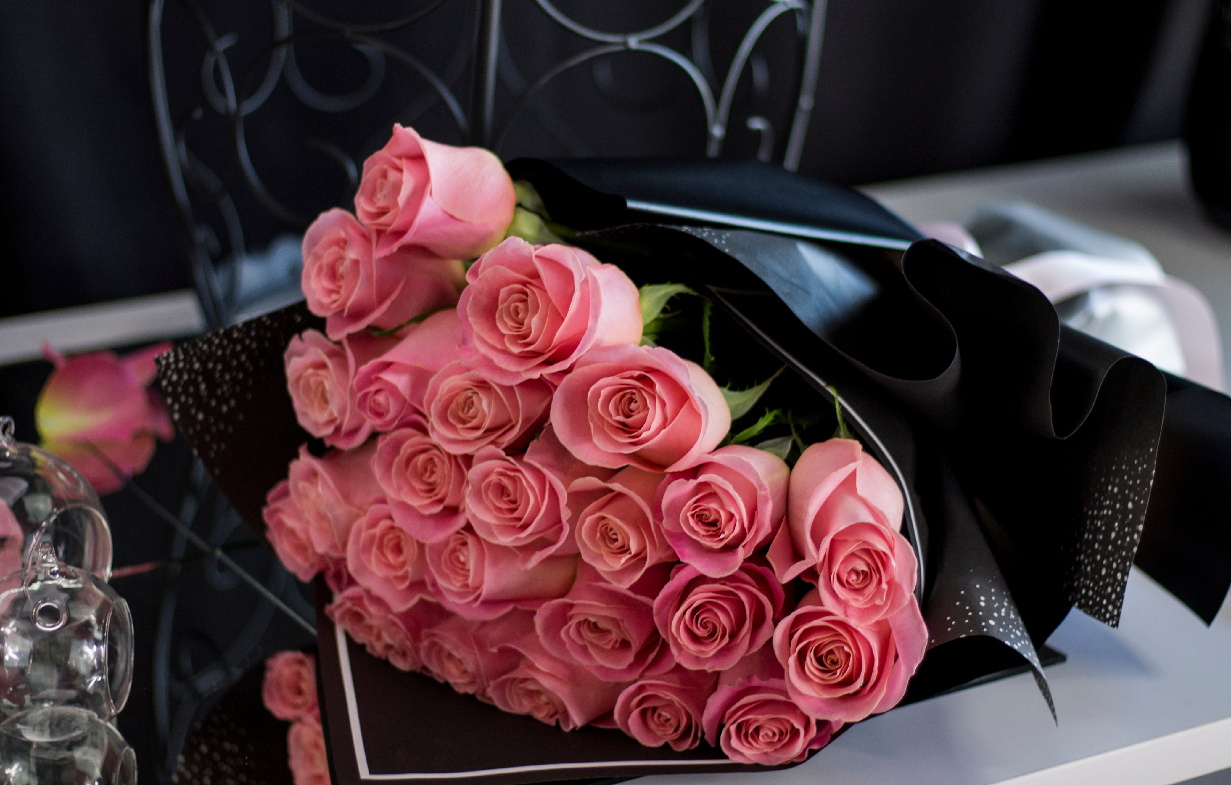 Fresh blush pink roses arranged in a hand-crafted bouquet