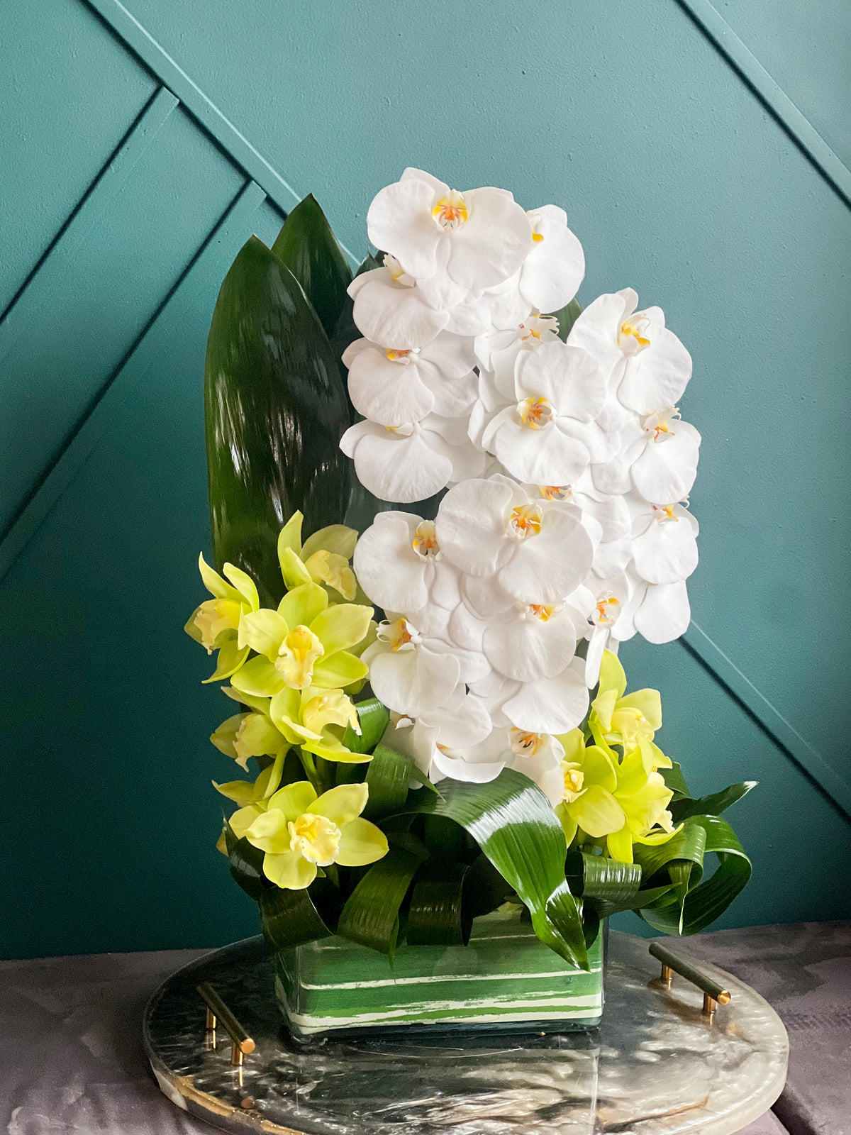 Fresh cut white orchids with tropical greenery Miami