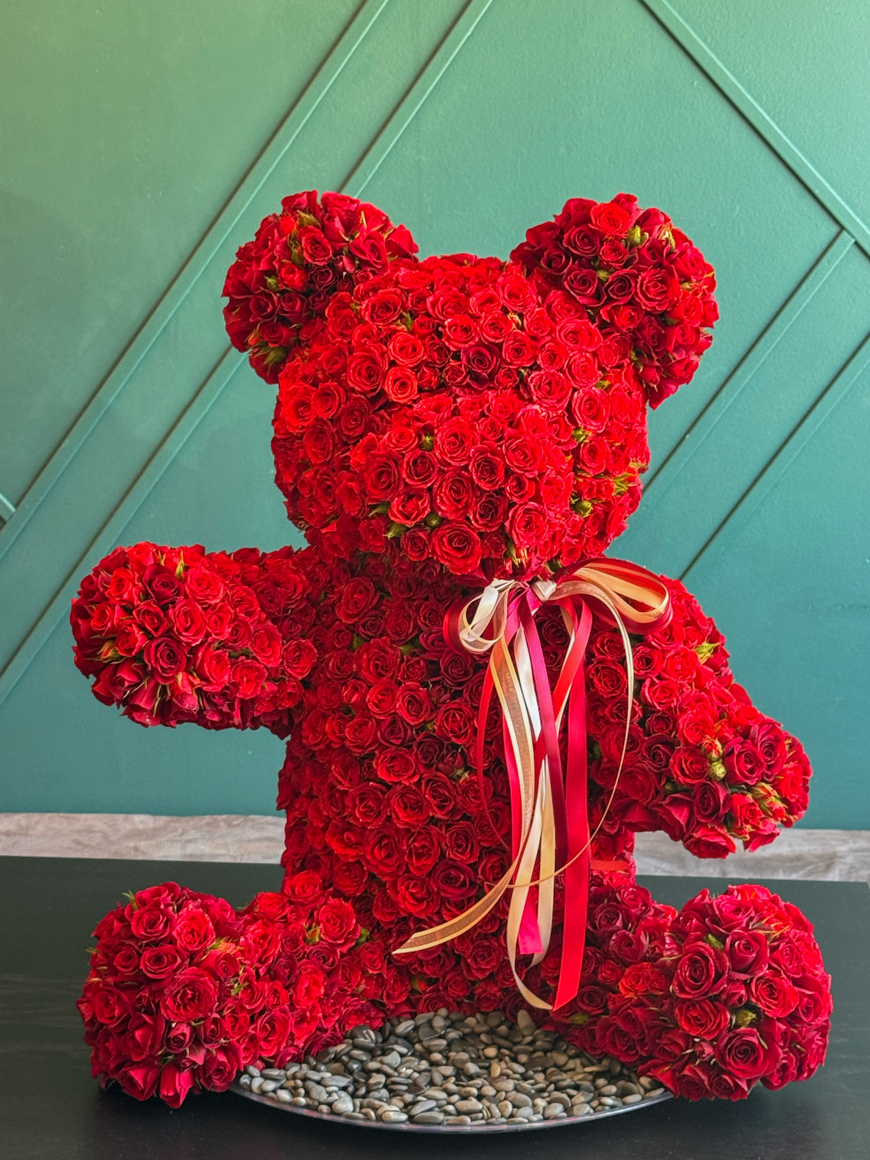 Fresh rose teddy bear displayed in luxury interior in Miami