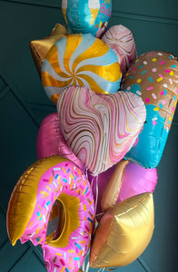 Fun birthday balloons with candy ice cream and star shapes