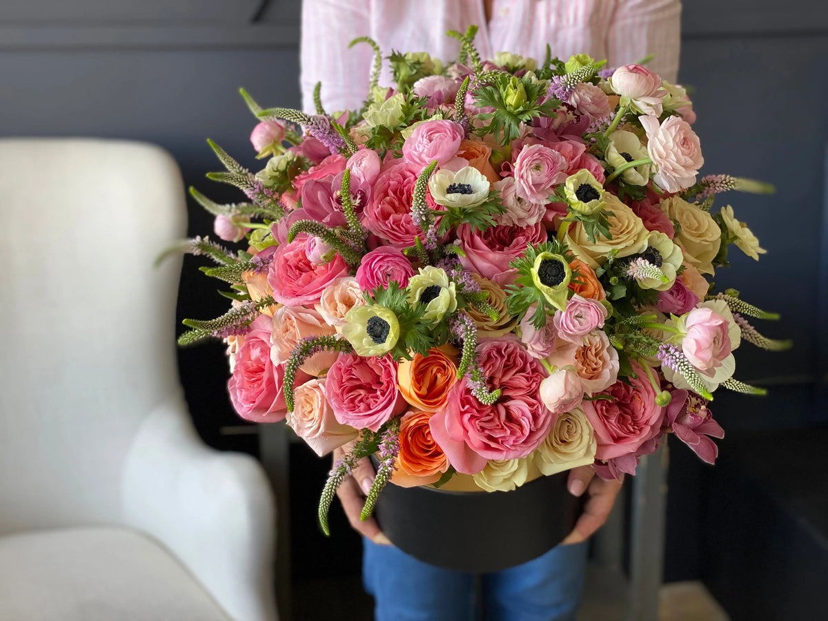 Garden-style floral arrangement in a large box by Luxury Flowers Miami