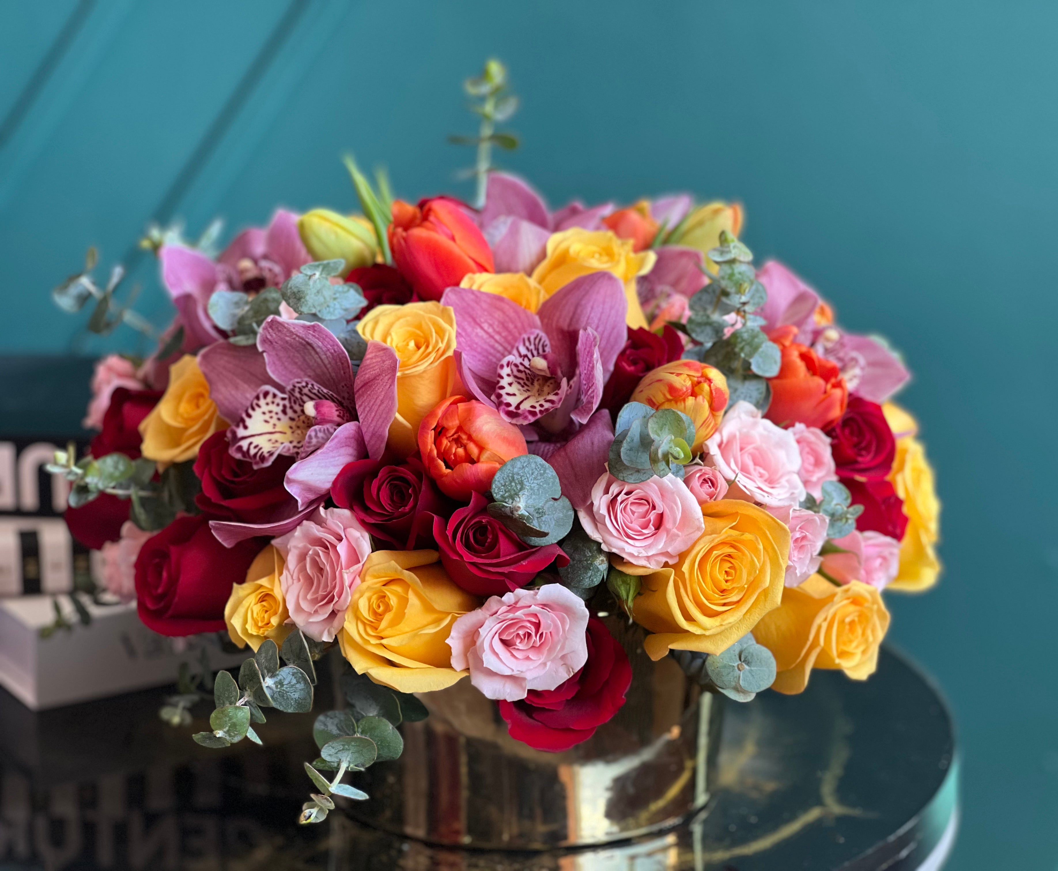 Garden roses, tulips and ranunculus flower arrangement