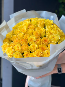 Golden yellow rose arrangement handcrafted by Luxury Flowers Miami