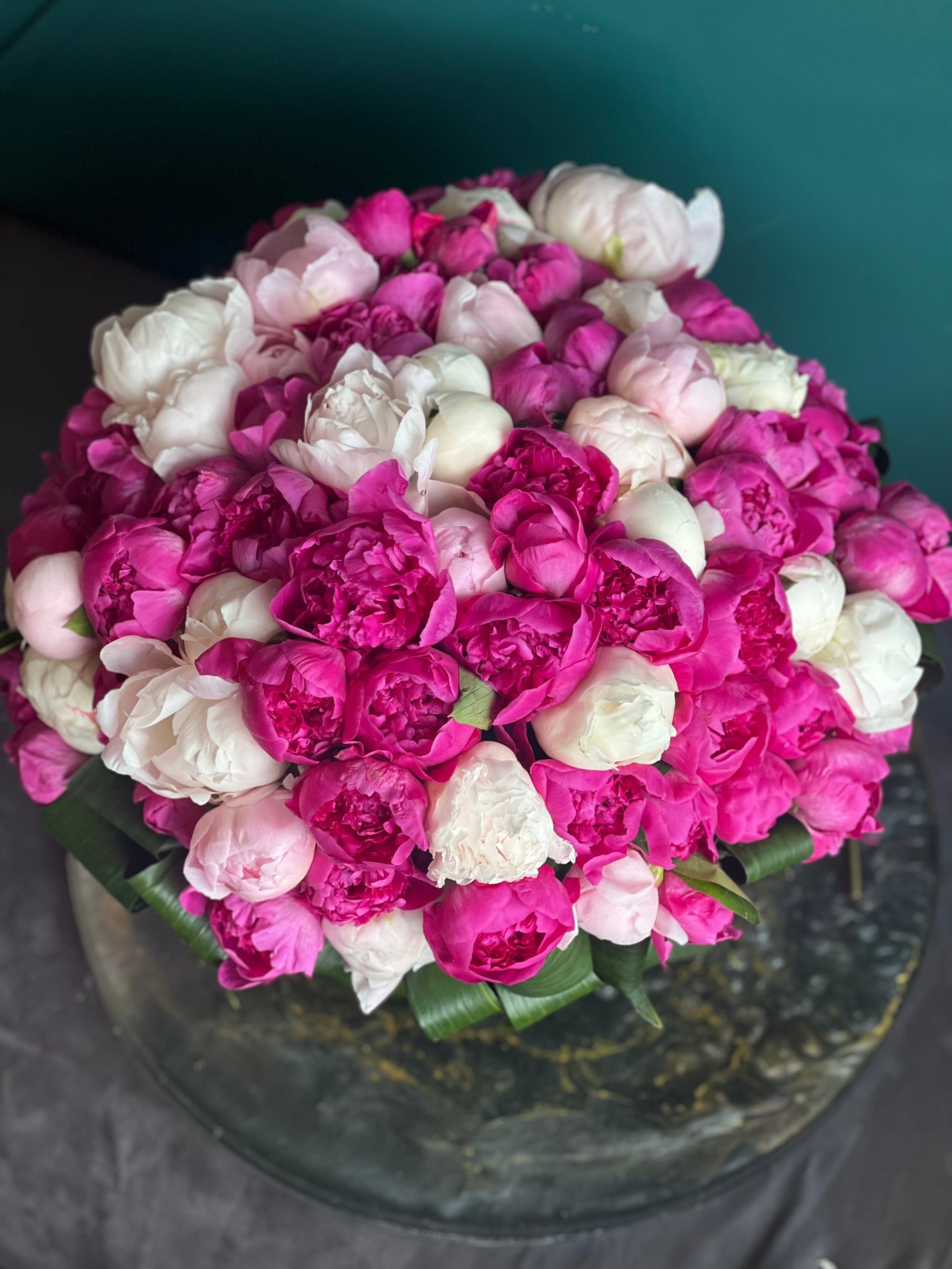 Grand arrangement of 100 fresh peonies