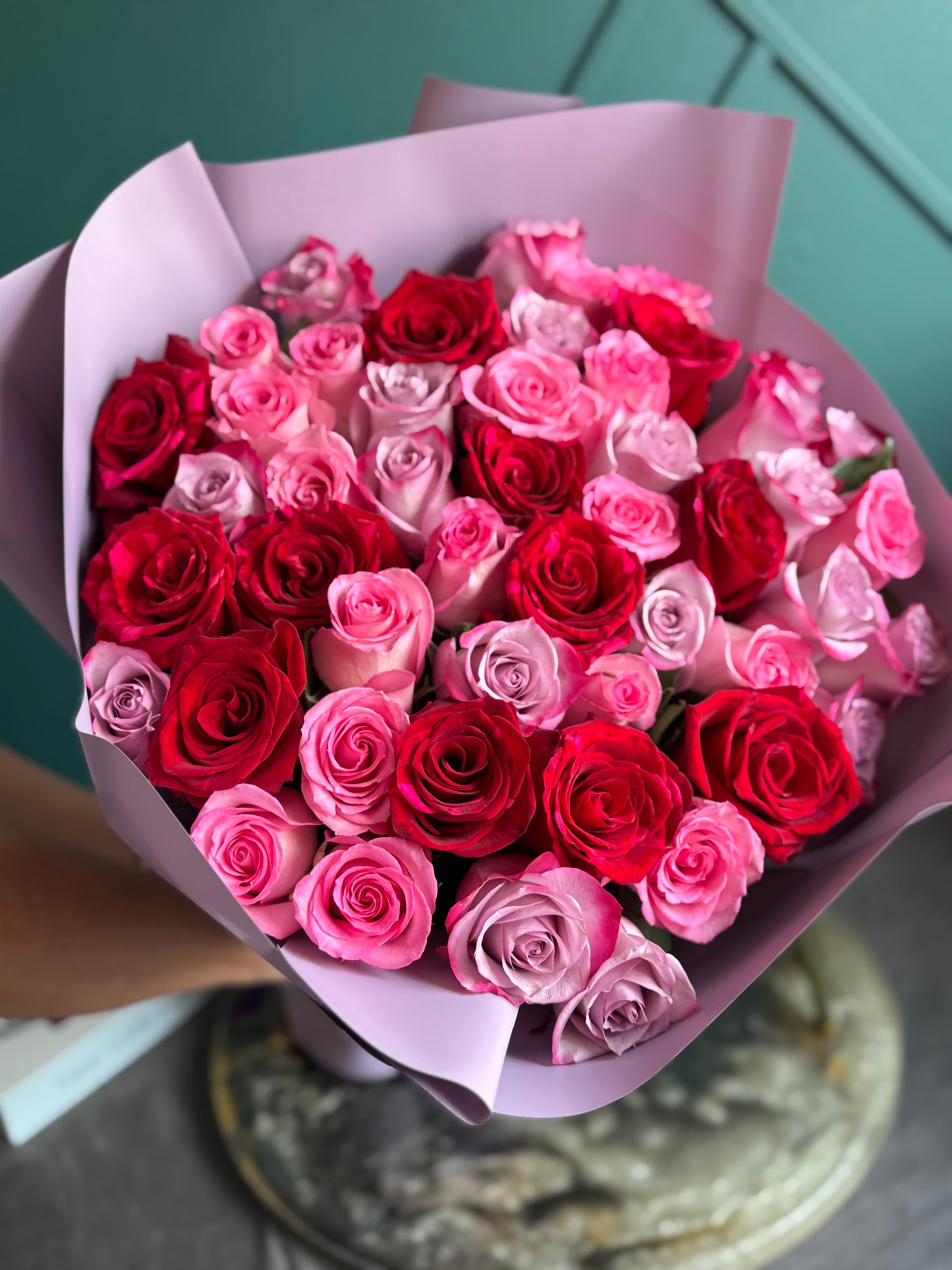 Hand-tied mixed rose bouquet with red and pink roses
