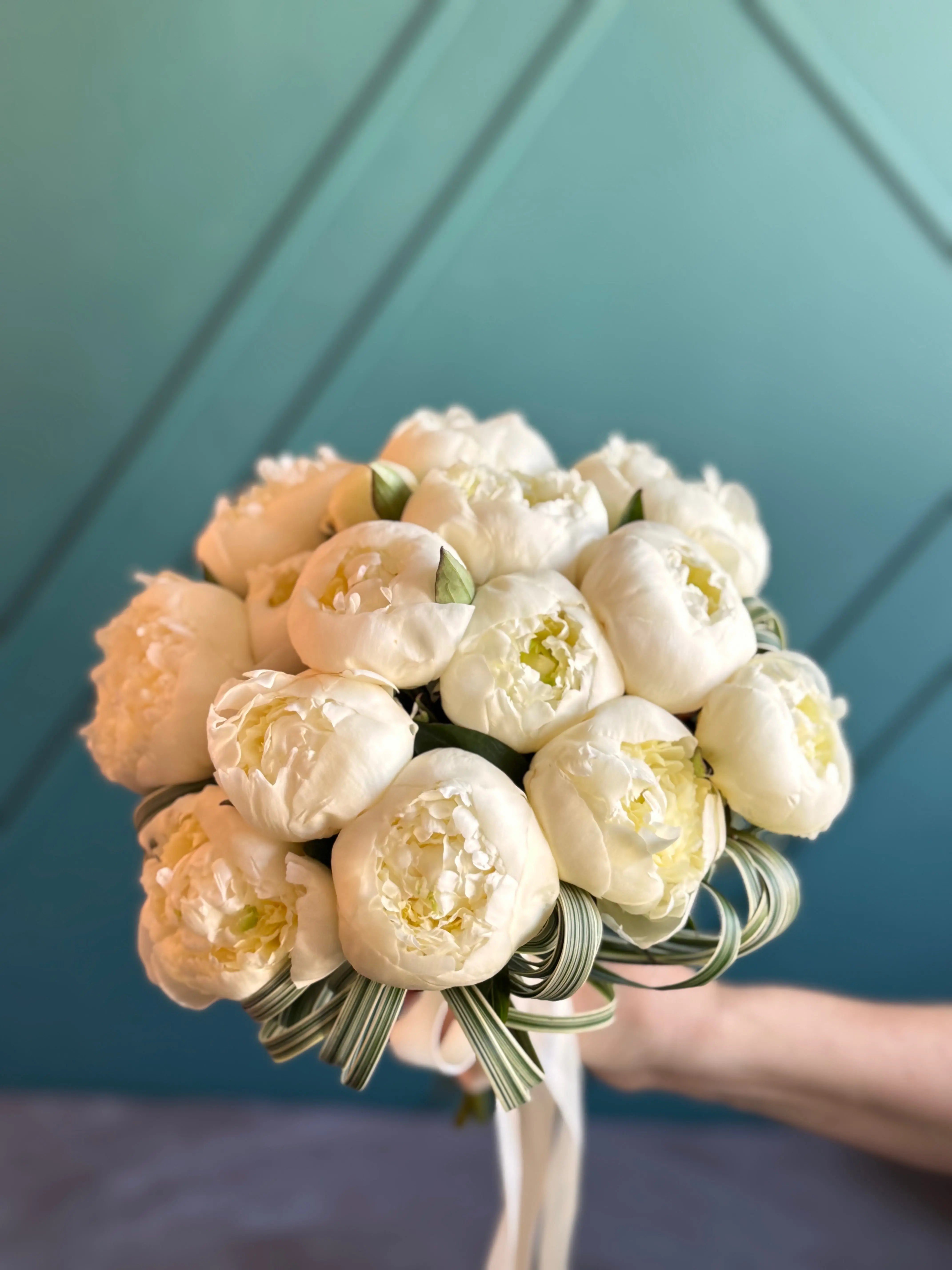 Hand-tied white peony bouquet for luxury Miami wedding
