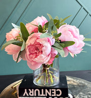 Handcrafted Real Touch pink peony arrangement in a clear glass vase with lush green foliage for elegant home décor.