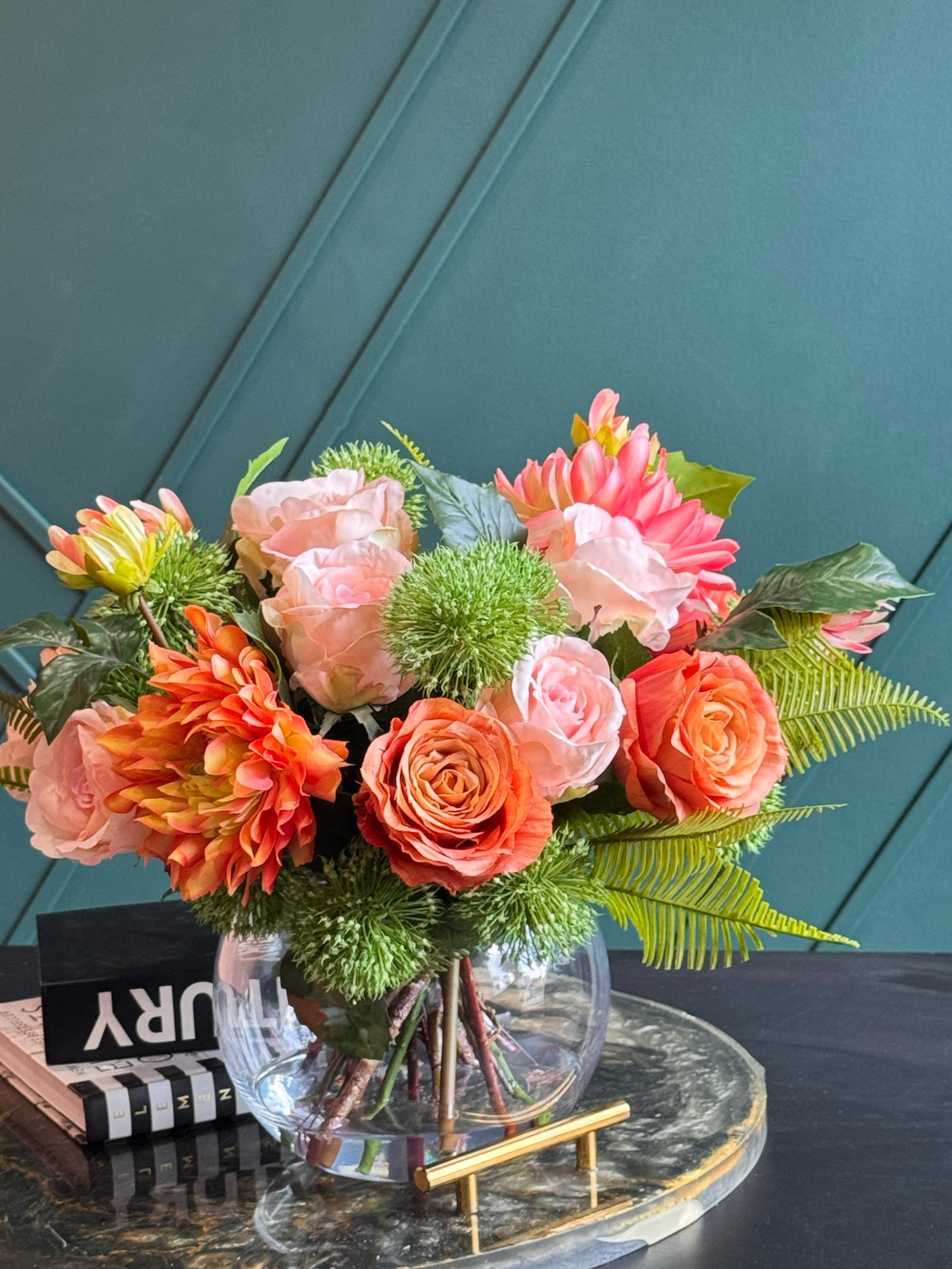 Handcrafted artificial flower centerpiece featuring pink peonies, coral dahlias, and blush roses.