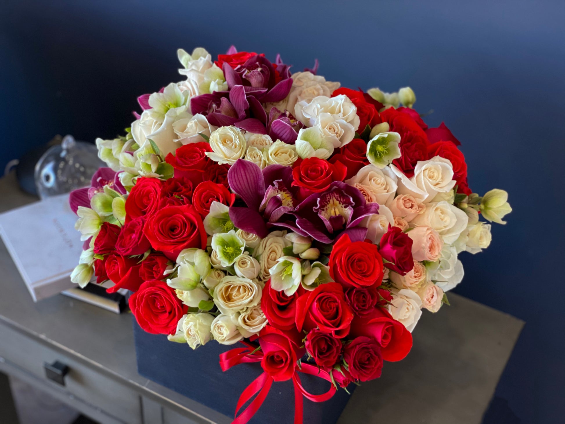 Handcrafted rose and cymbidium orchid arrangement Miami Beach