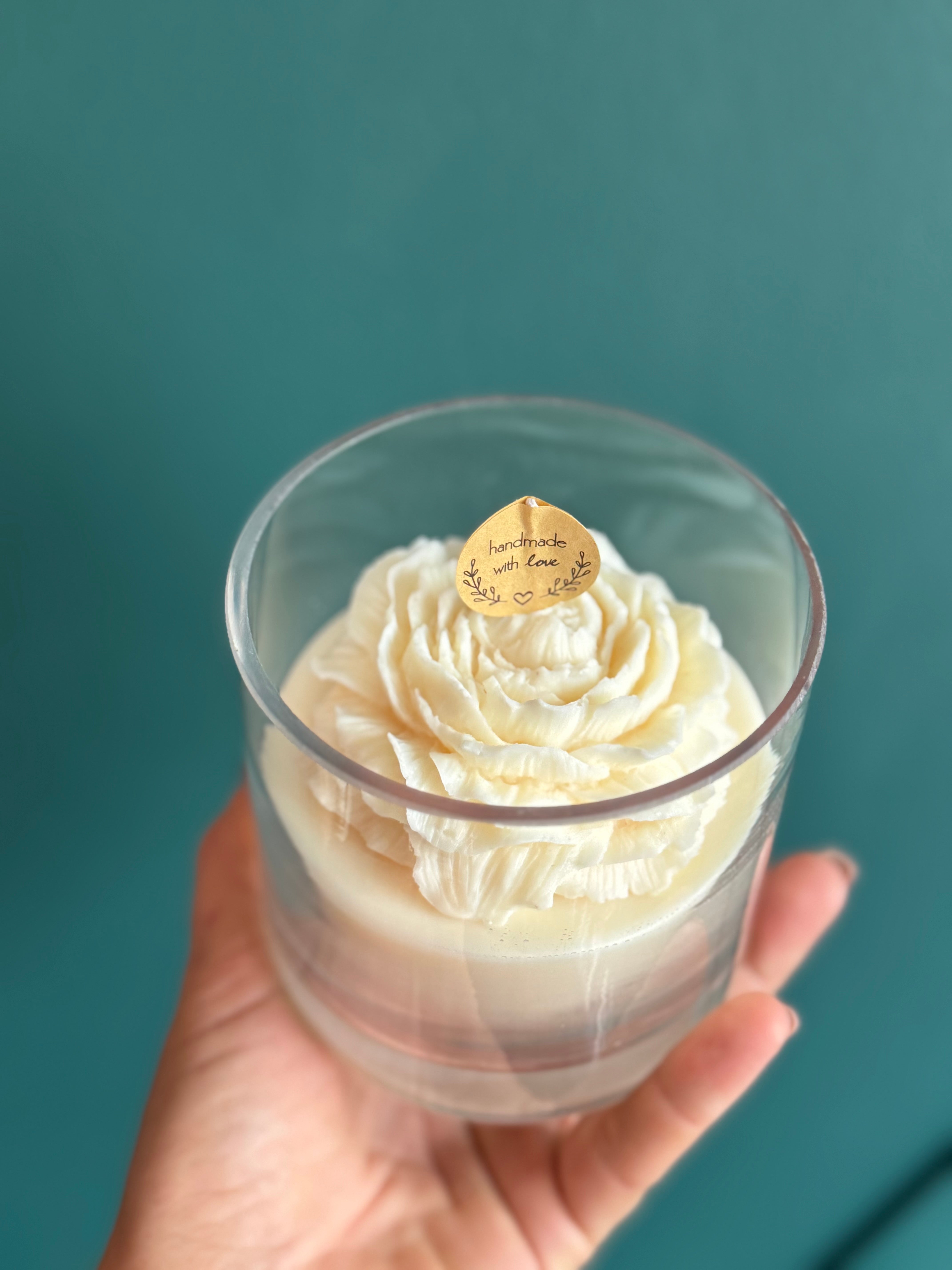 Handcrafted soy wax floral candle in clear glass