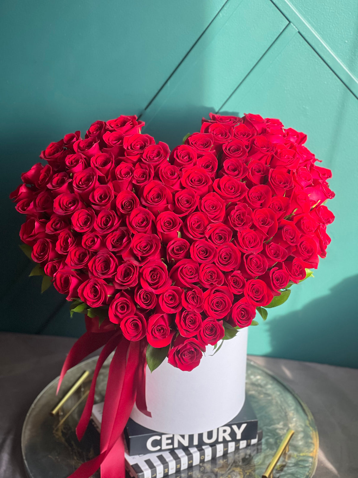 Heart shaped arrangement of 100 red roses in luxury box