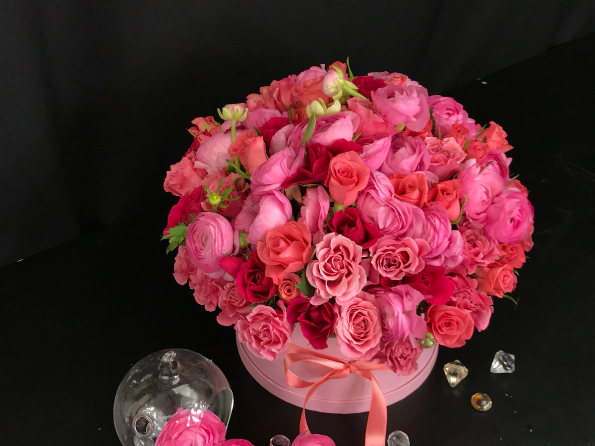 Hot pink roses and mini roses flower arrangement