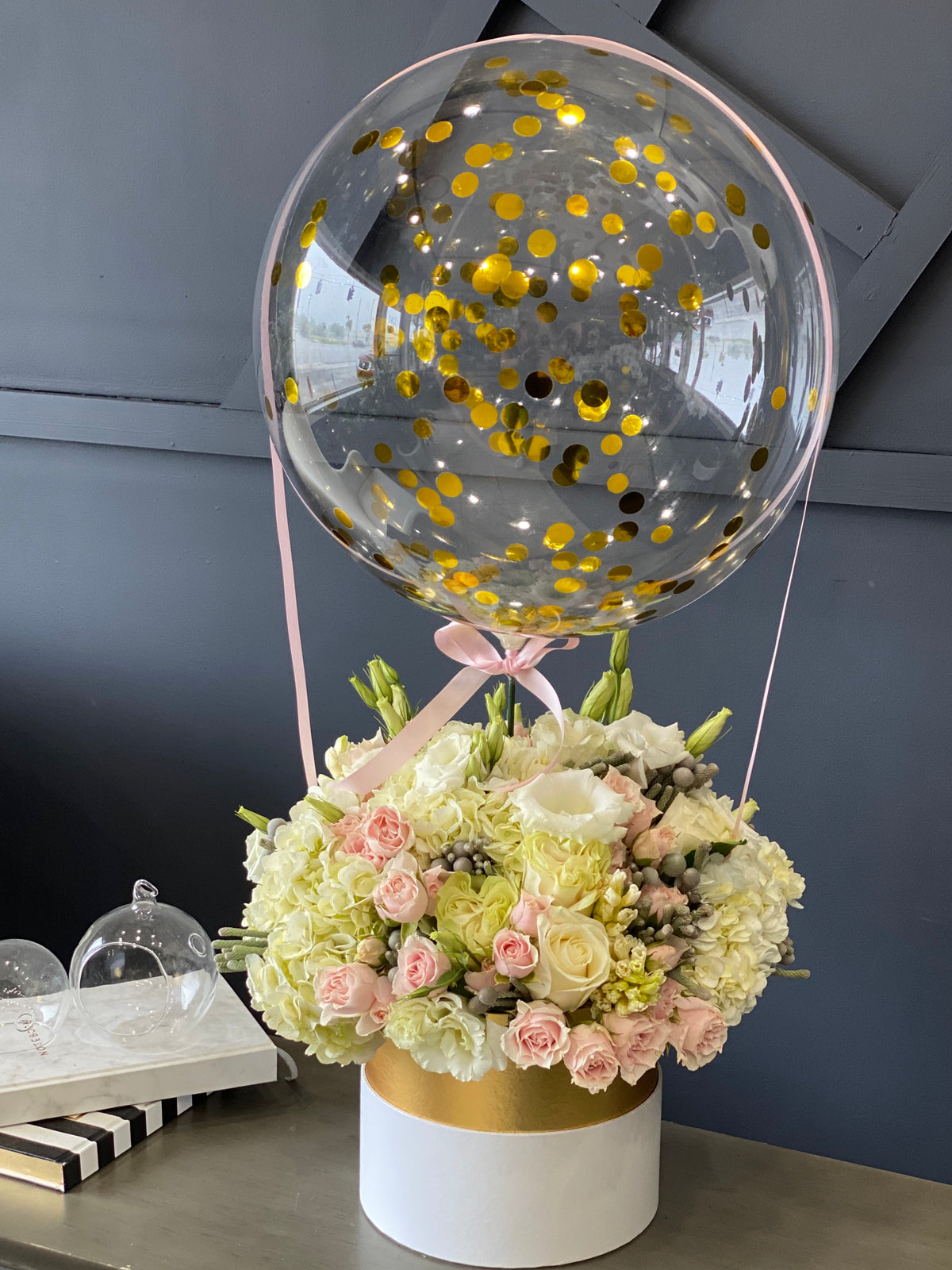 Hydrangeas roses spray roses and lisianthus with balloon