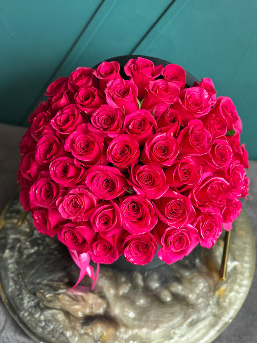 50 Hot Pink roses in a box