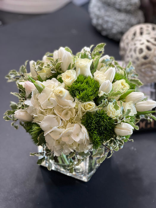 White and green flower design in a vase