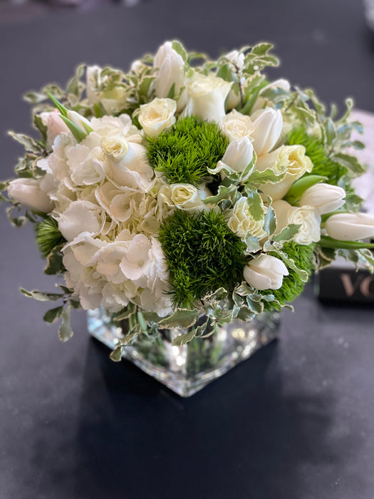 White and green flower design in a vase
