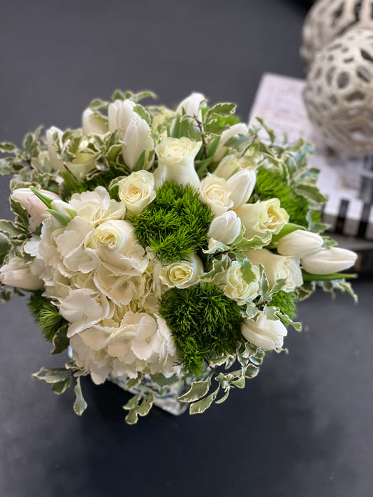 White and green flower design in a vase