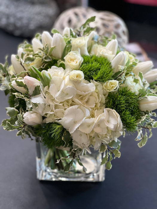 White and green flower design in a vase