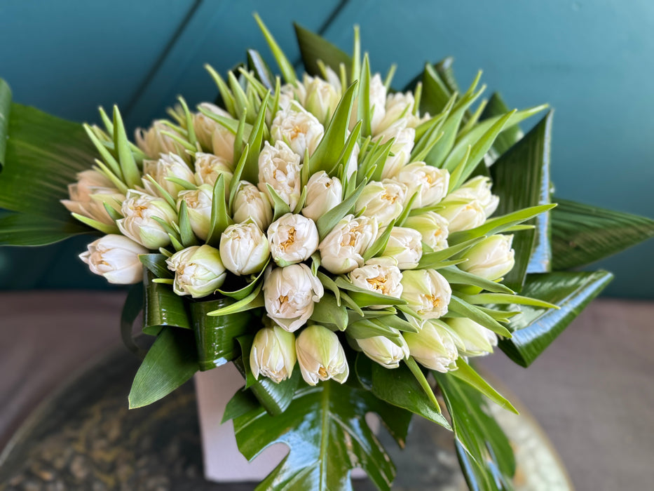 50 White Tulips In ceramic vase