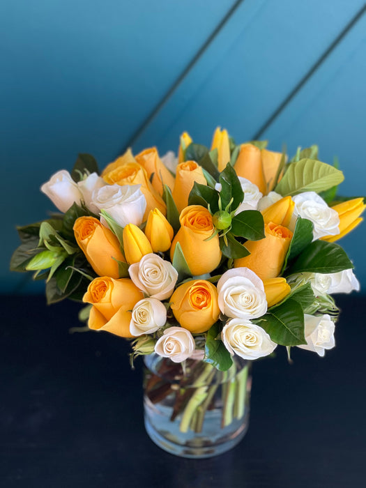 Bright mixed flower arrangement in a vase