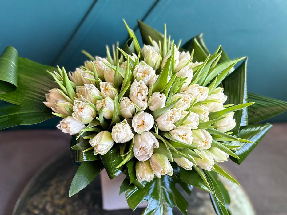 50 White Tulips In ceramic vase