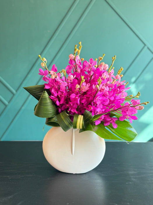 18 mokara Orchids in a vase