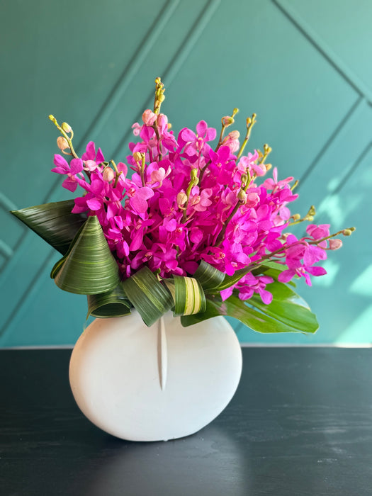 18 mokara Orchids in a vase