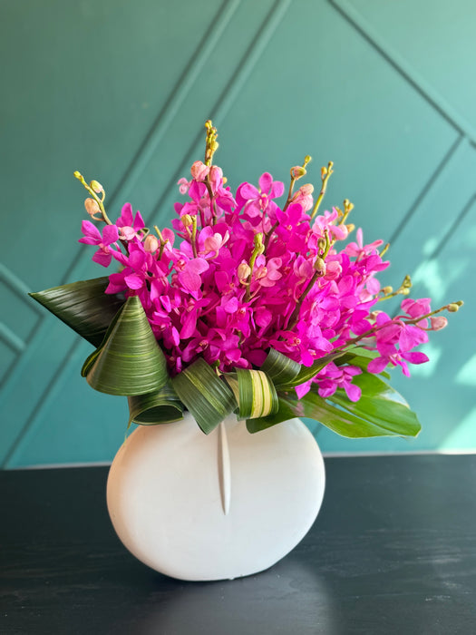 18 mokara Orchids in a vase
