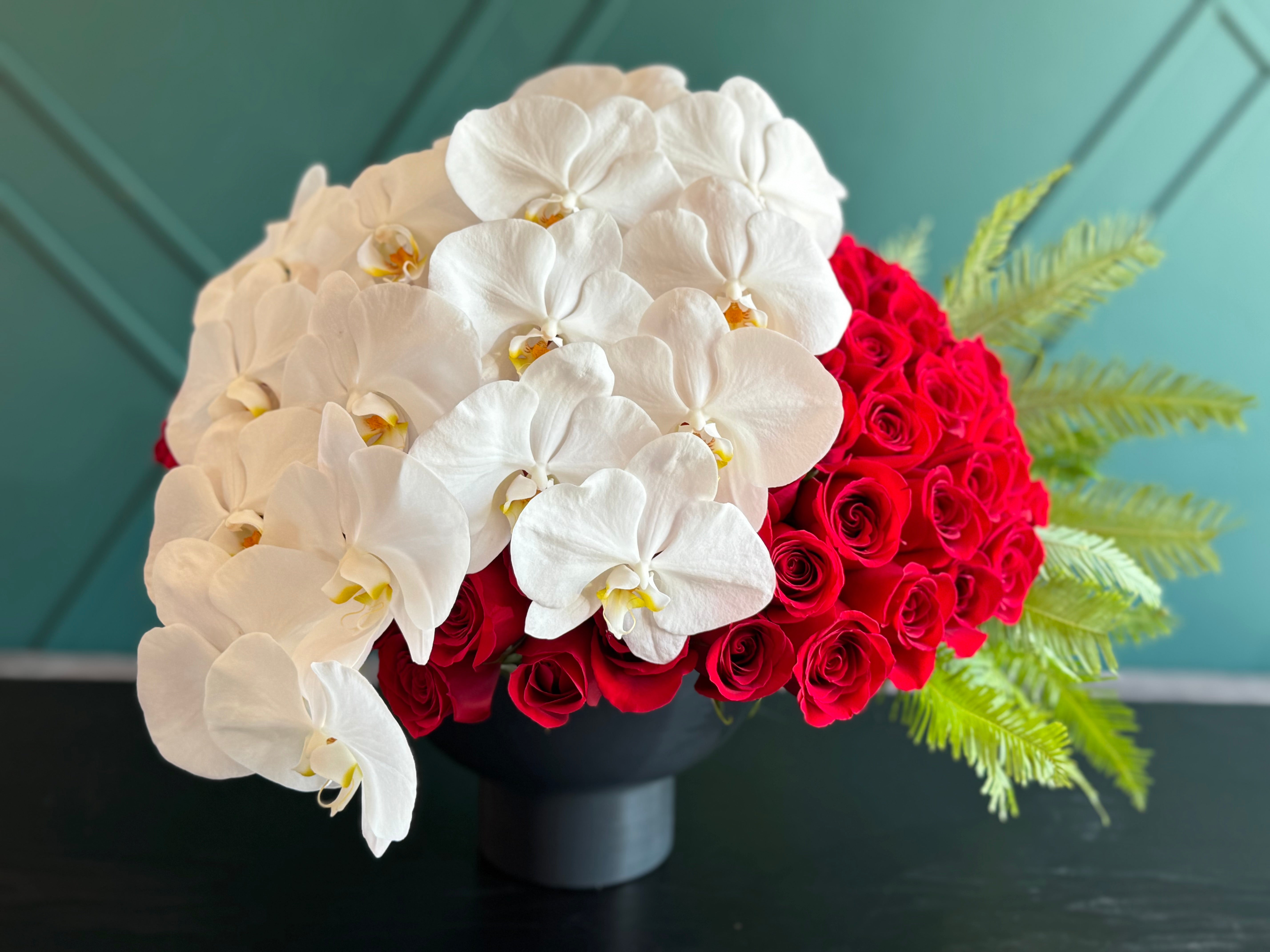 150 Red Roses & White Phalaenopsis Luxury Arrangement