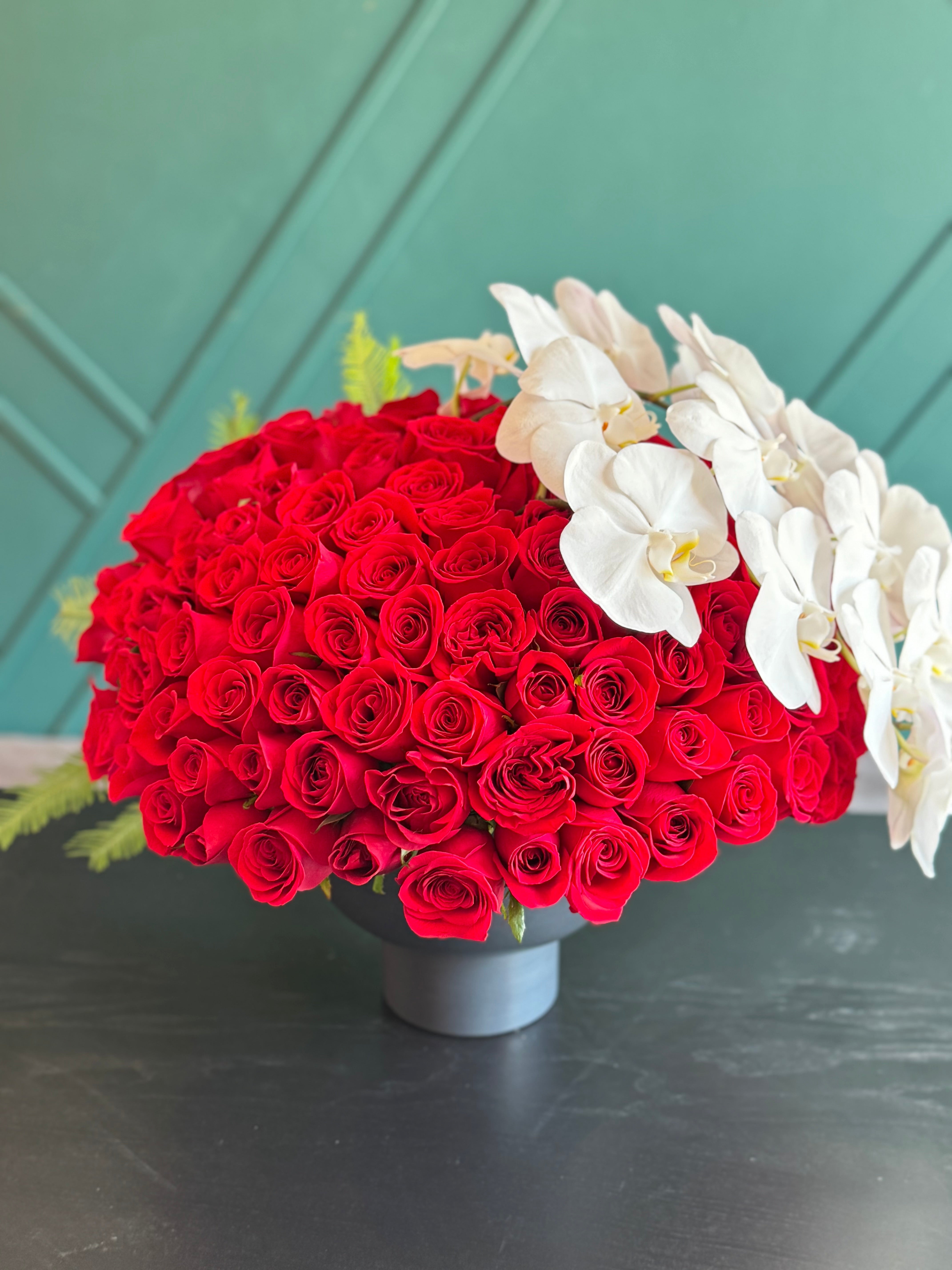 150 Red Roses & White Phalaenopsis Luxury Arrangement