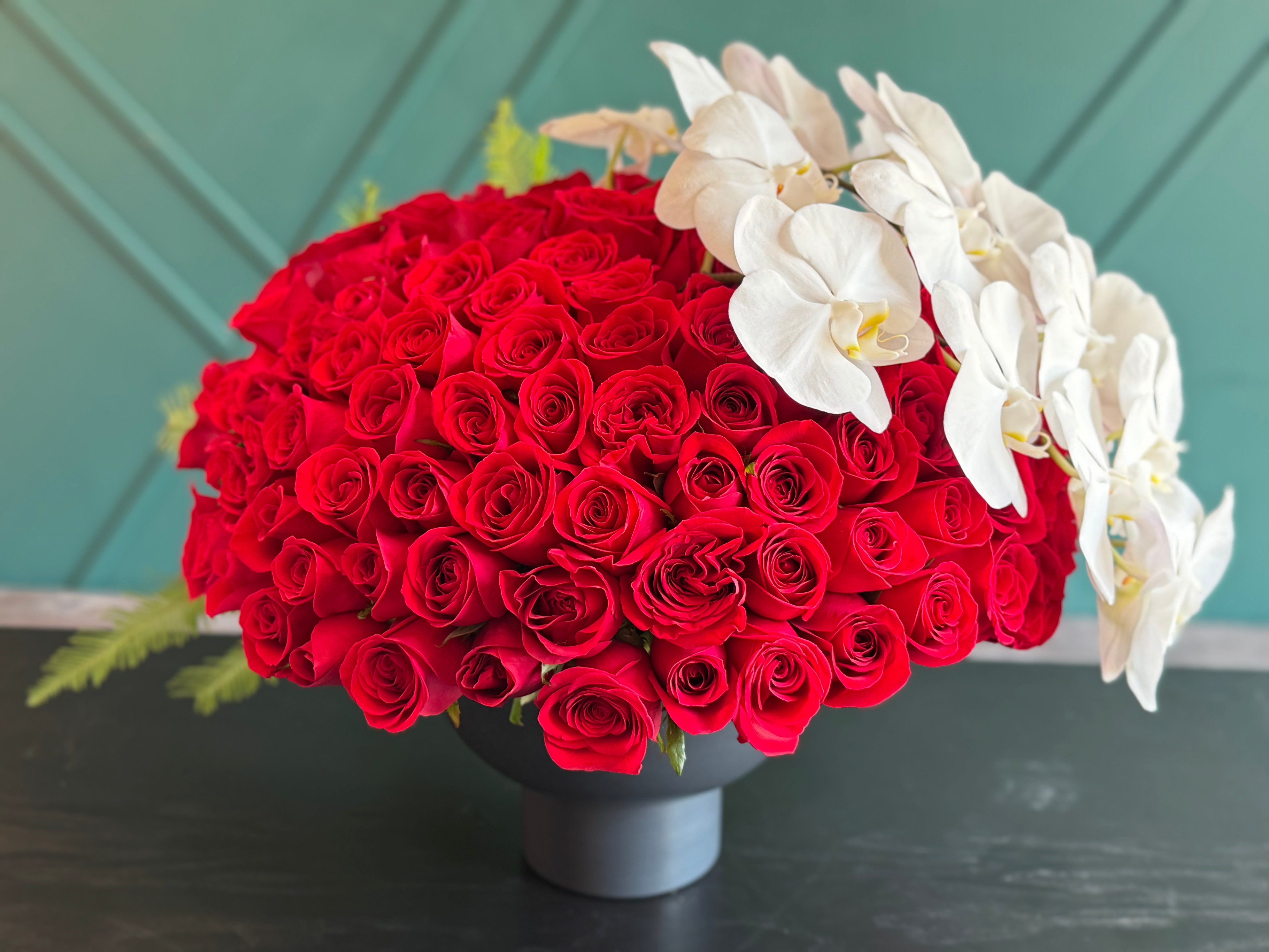 150 Red Roses & White Phalaenopsis Luxury Arrangement