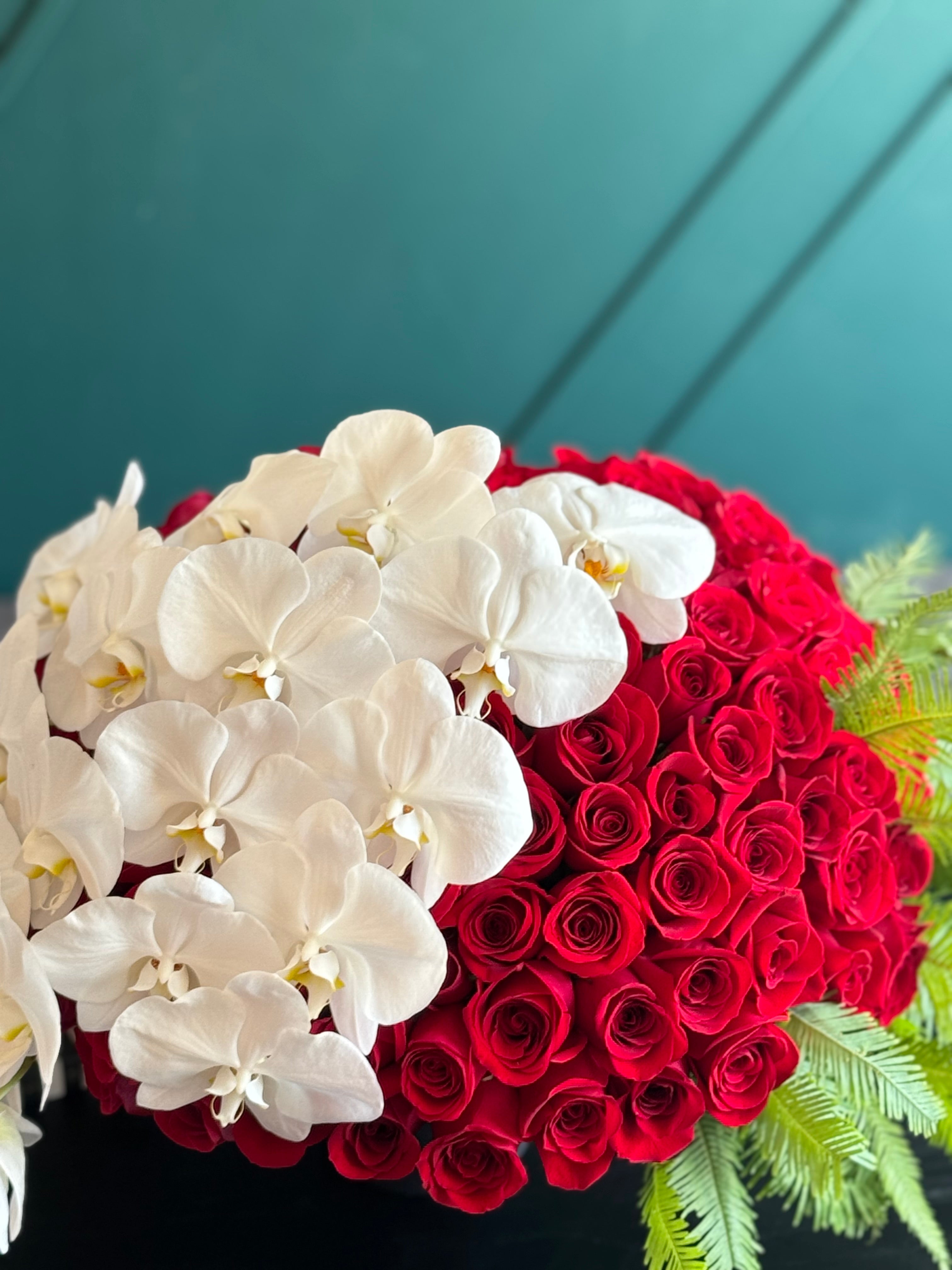 150 Red Roses & White Phalaenopsis Luxury Arrangement