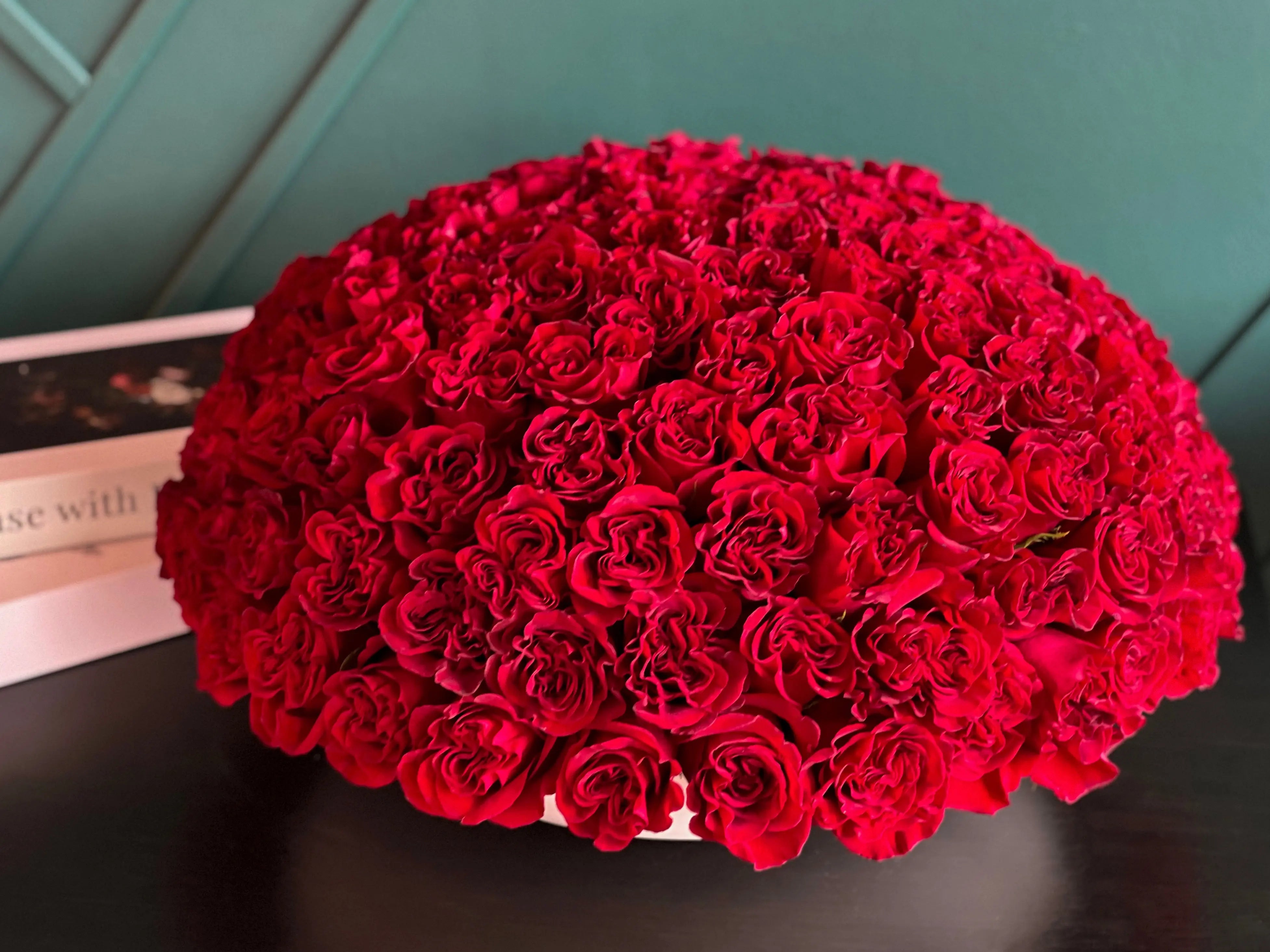 Large 150 red roses arrangement in cement bowl