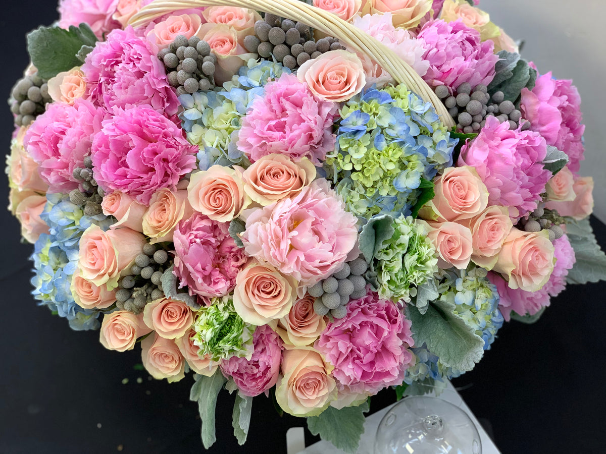 Large luxury flower basket with blush roses pink peonies and blue hydrangeas